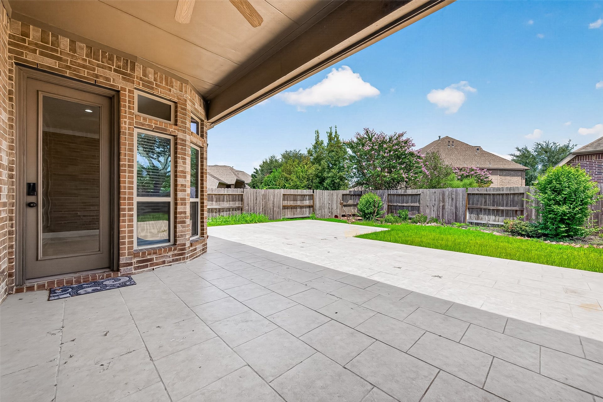 27818 Tamara Branch Lane, Katy, TX 77494 Step outside to a generously sized backyard designed for low-maintenance living and entertaining, complete with extended stone pavers that create the perfect outdoor gathering space.