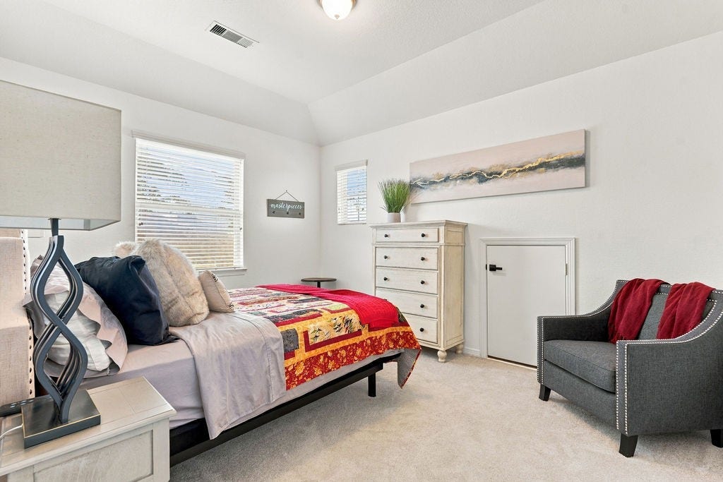 9918 Hubble Drive, Iowa Colony, TX 77583 Bedroom 2- Upstairs w/ walk-in closet and attic access door.