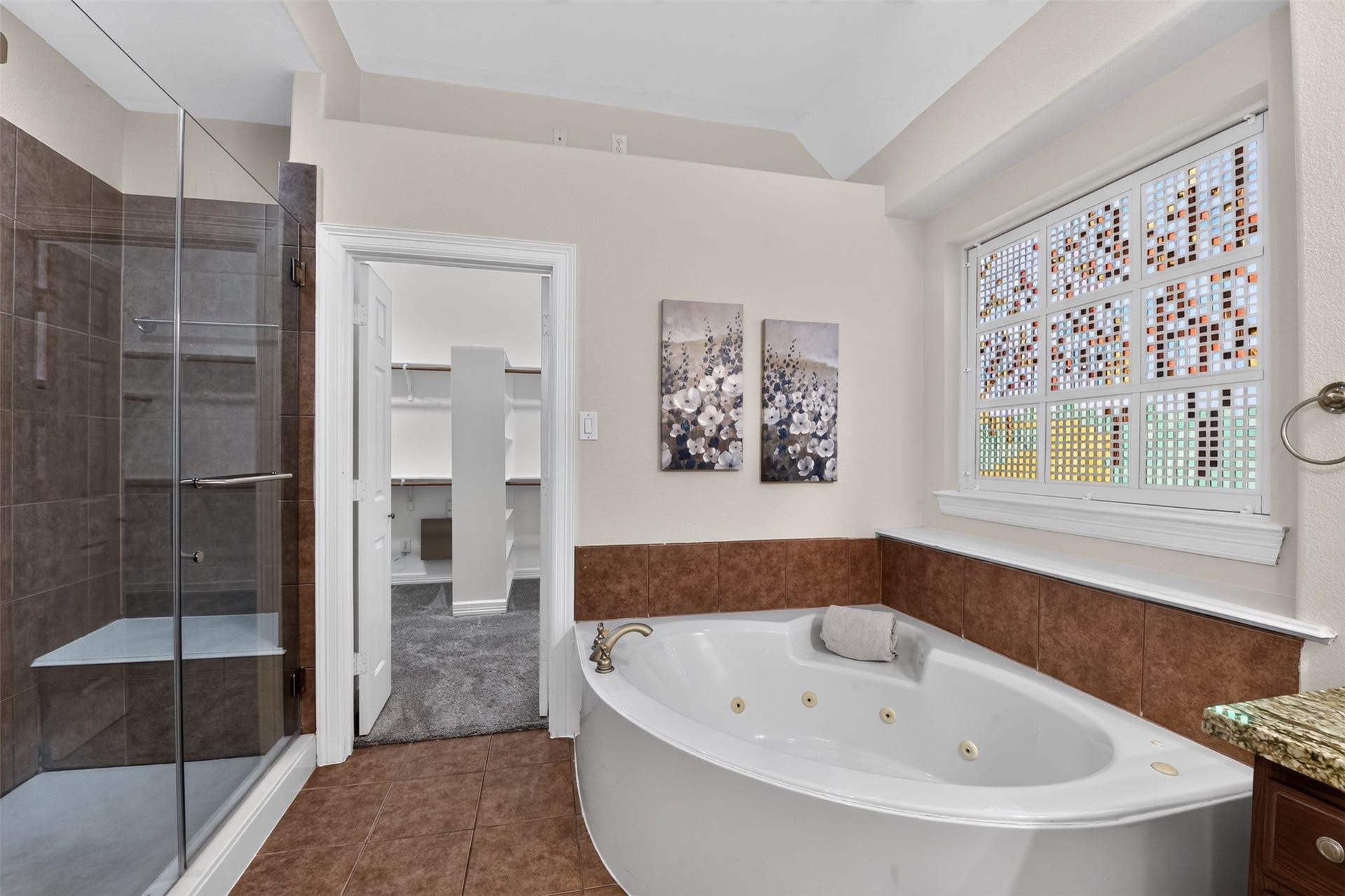 12009 Cedar Creek Drive, Pearland, TX 77584 Oversized walk-in shower with bench seat. Frame glass shower enclosure. Also, there is a large walk-in closet with built-ins!