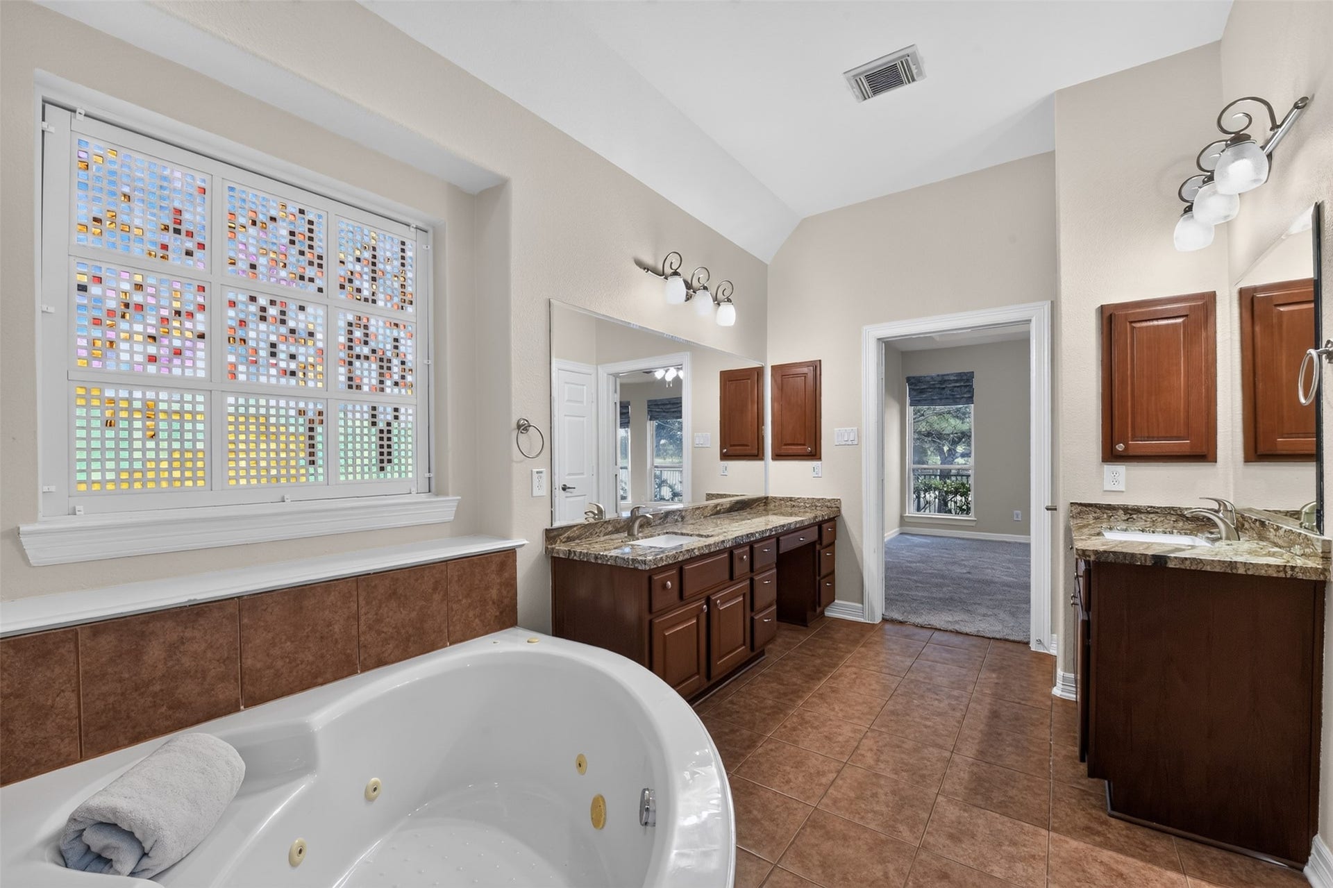12009 Cedar Creek Drive, Pearland, TX 77584 Vanity seating with plenty of cabinet space, and this large tub to help you soak away any stress!