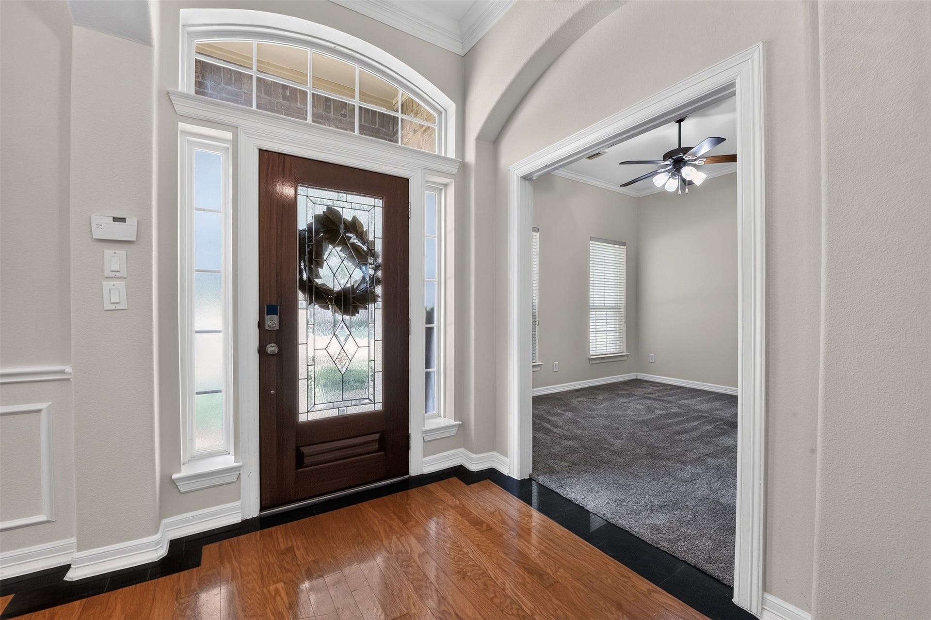 12009 Cedar Creek Drive, Pearland, TX 77584 Step inside and fall in love! Thoughtful decorative touches throughout and they start here... with granite accented hardwood flooring. There is also a brushed nickel chandelier, plenty of natural light and beautiful decorative wall moldings.