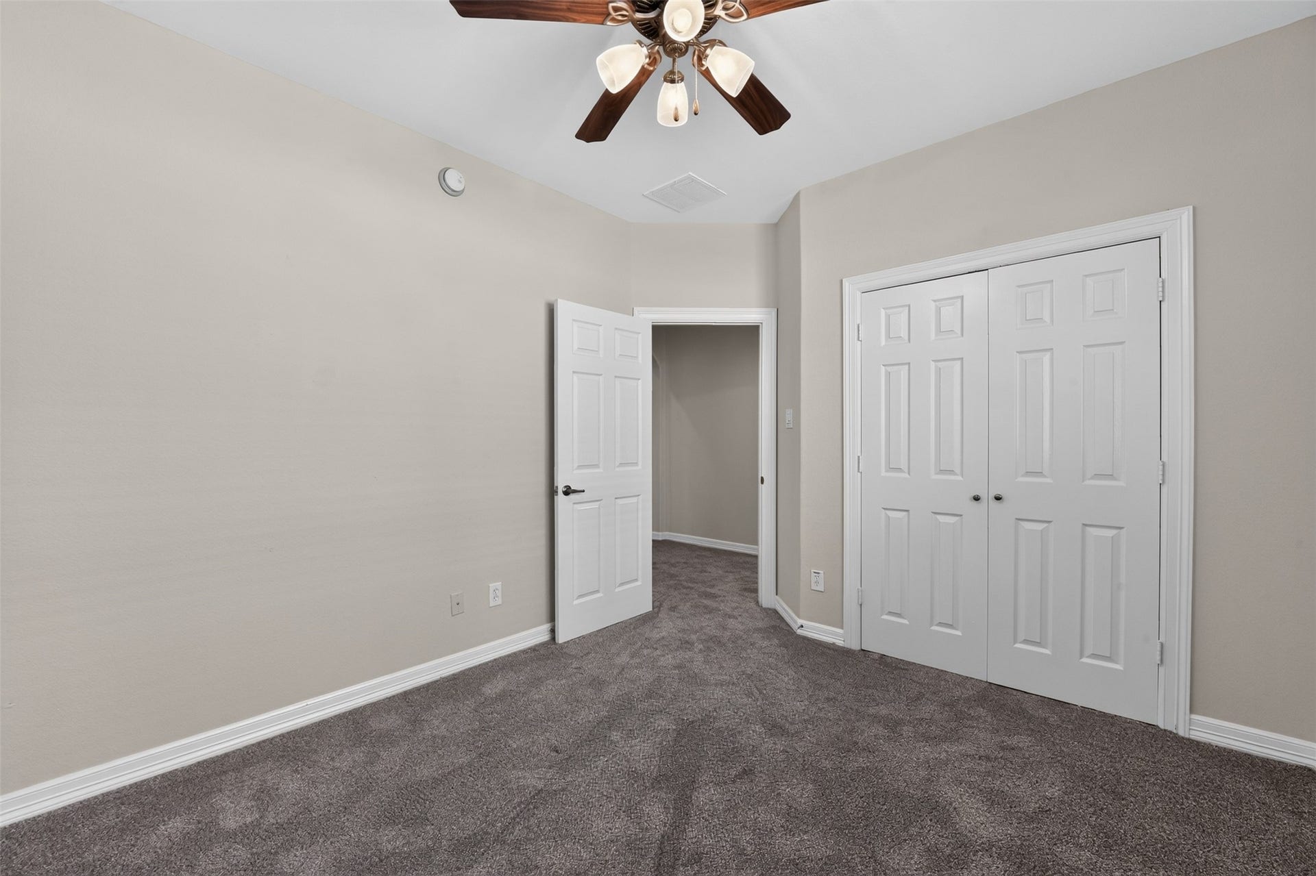 12009 Cedar Creek Drive, Pearland, TX 77584 This secondary bedroom (4th) offers a great closet space and a lighted ceiling fan.
