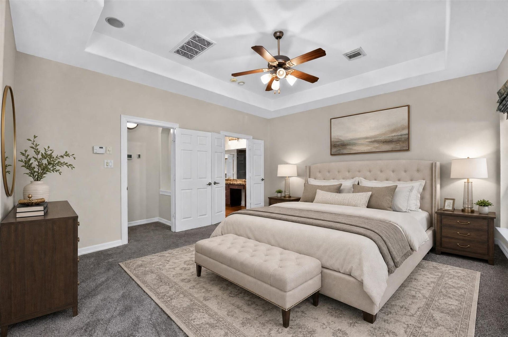 12009 Cedar Creek Drive, Pearland, TX 77584 The primary bedroom is spacious and offers a tray ceiling with lighted fan. Double doors open to the private primary bathroom.