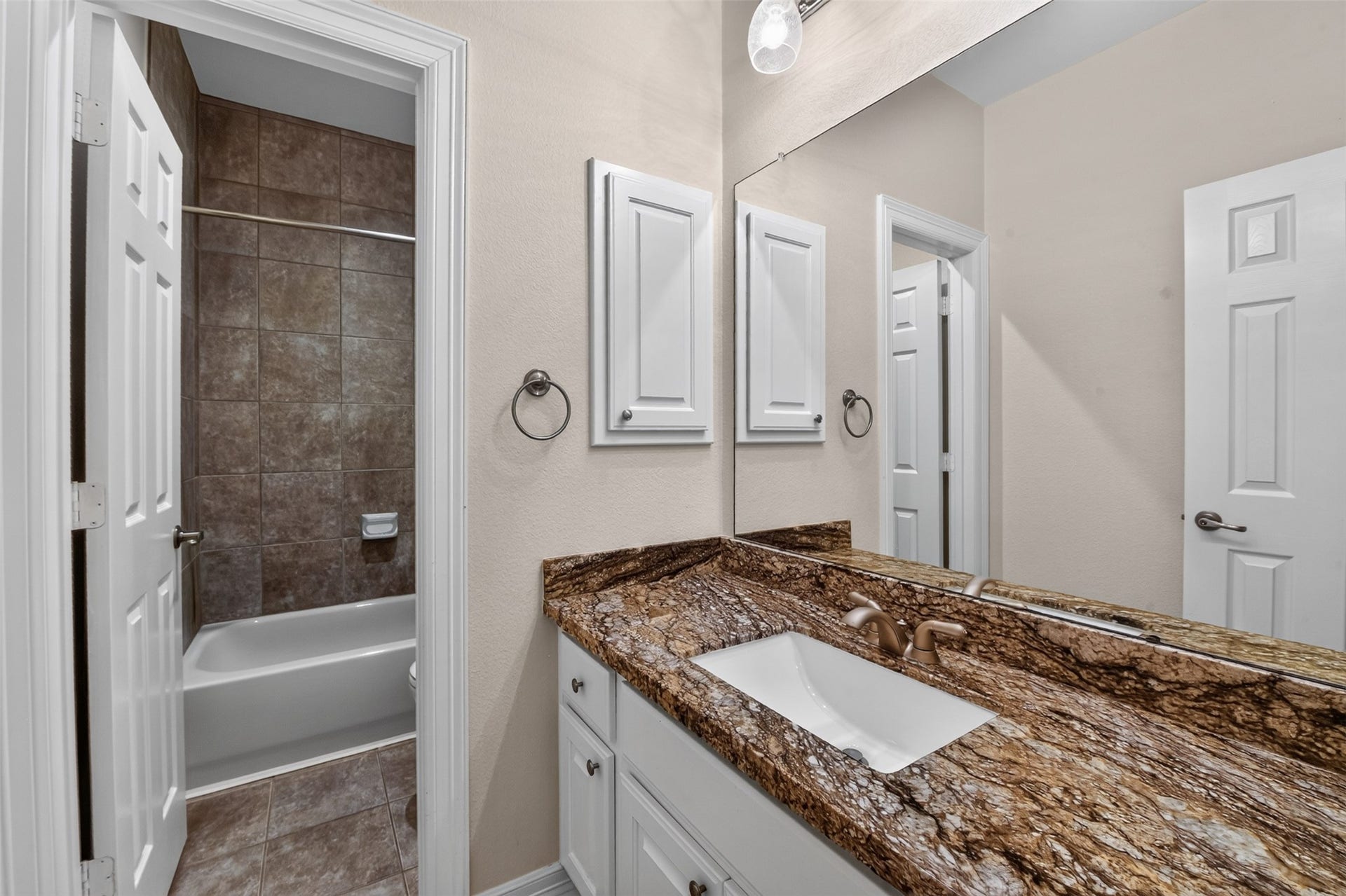 12009 Cedar Creek Drive, Pearland, TX 77584 Secondary bathroom with great tile work and granite countertop.