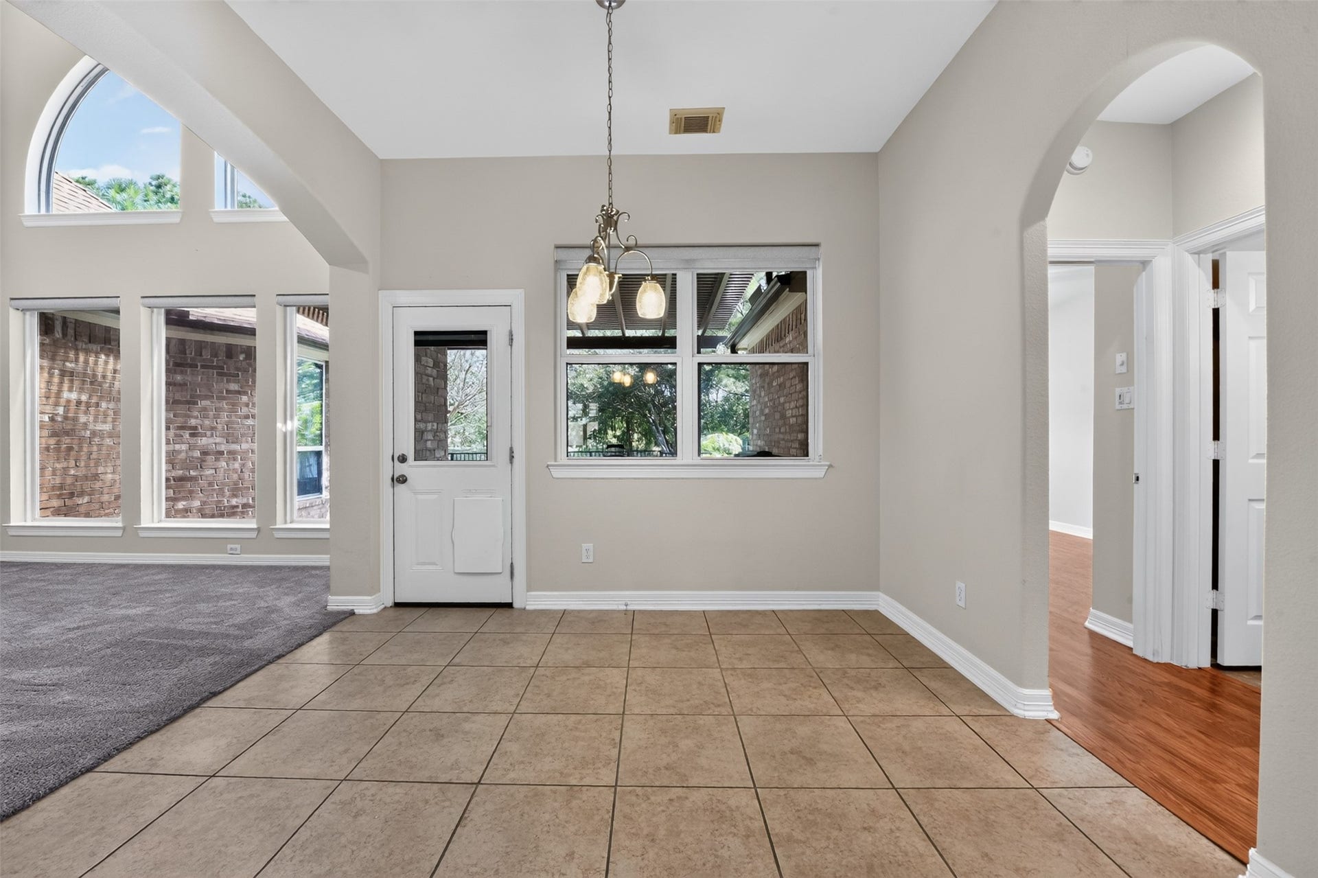 12009 Cedar Creek Drive, Pearland, TX 77584 The breakfast area has tile flooring and access to the spacious patio.