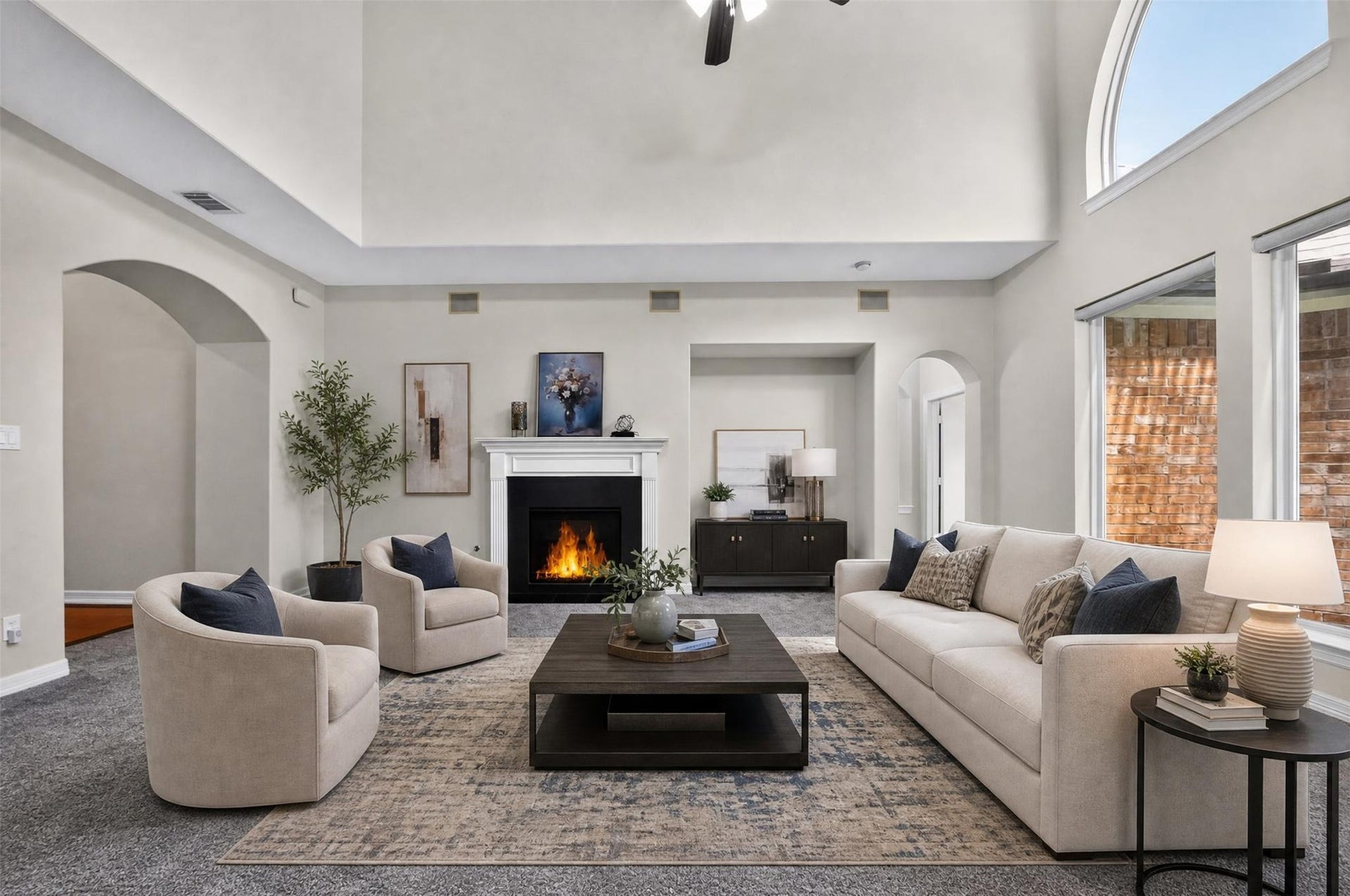12009 Cedar Creek Drive, Pearland, TX 77584 The living room is gorgeous with tile surround gas log fireplace, surround sound speakers, a dramatic elevated ceiling and impressive wall of windows overlooking the backyard and views of the lake!