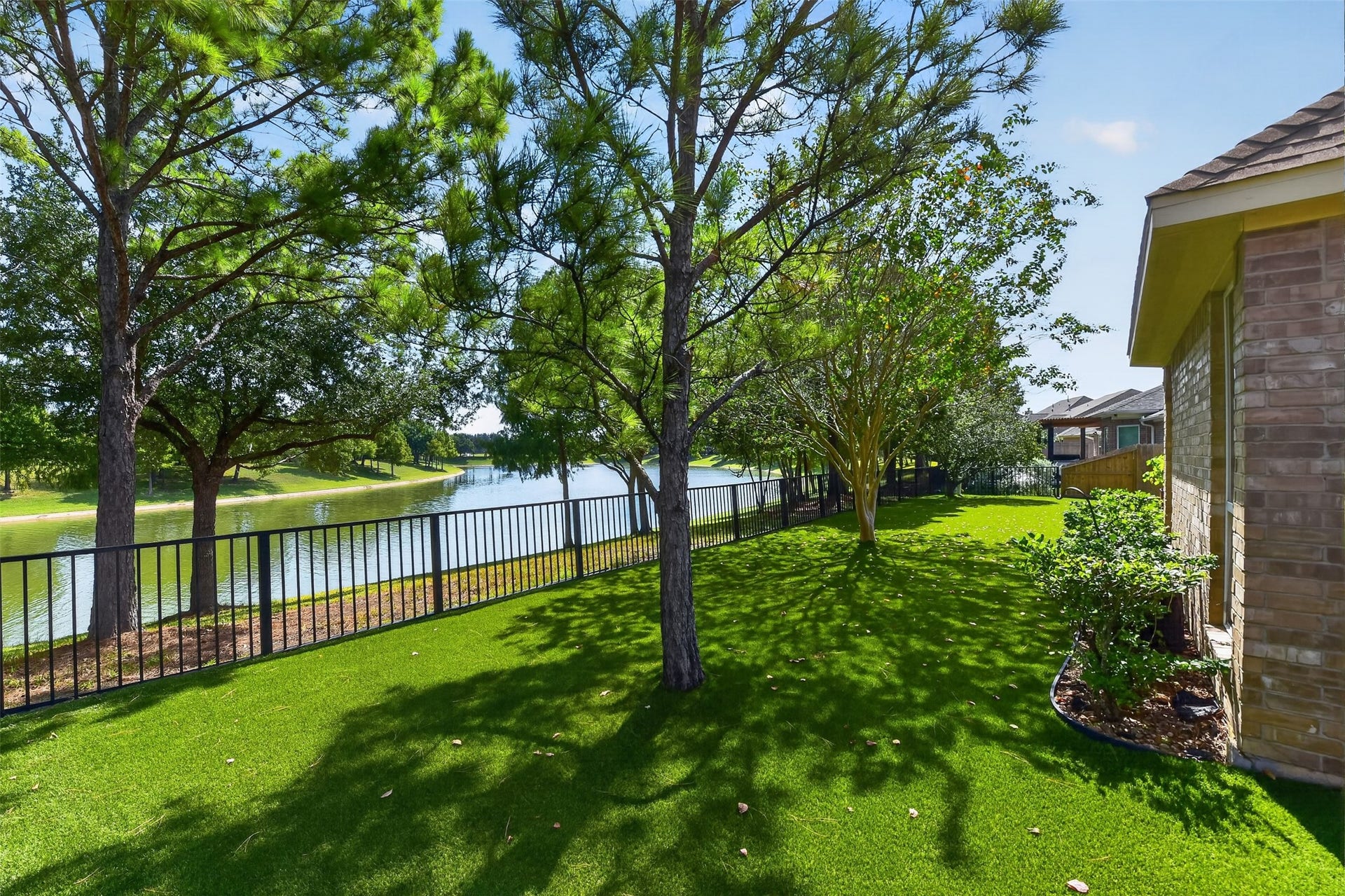 12009 Cedar Creek Drive, Pearland, TX 77584 A backyard that is always ready to enjoy! Note the difference on the other side of the gate.