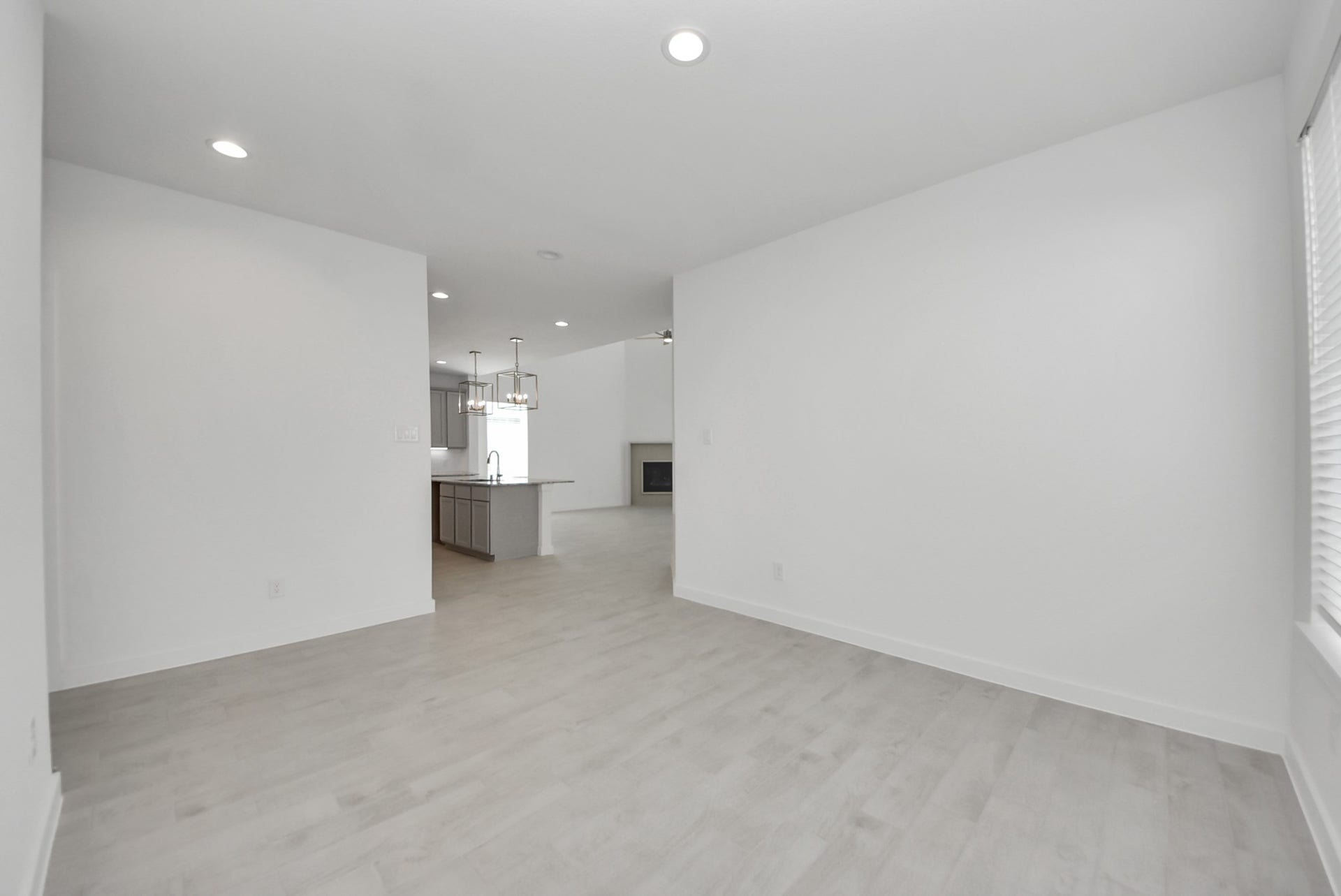 Make memories gathered around the table with your family and friends! This spacious dining room features elegant flooring, custom paint, and adjacent to family room and kitchen for open concept feel.