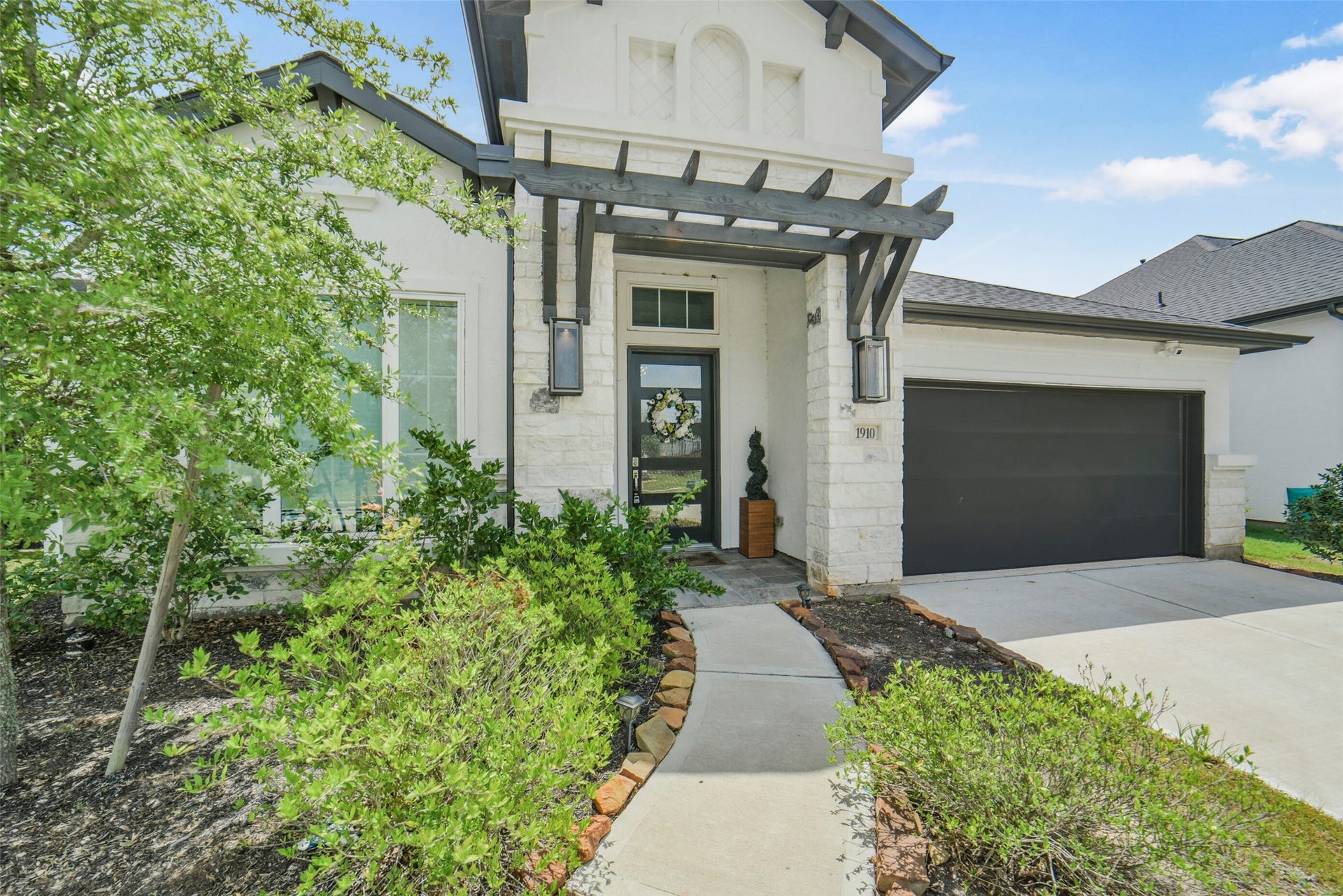 1910 Longcroft Lane, Katy, TX 77493 Beautiful stone and stucco exterior with contemporary design.