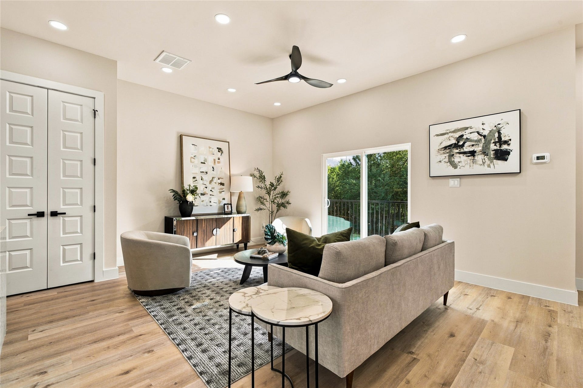 4717 Branch Street, Houston, TX 77021 Light-filled main lounge sunlit living room with direct balcony access designed for weekend lounging.