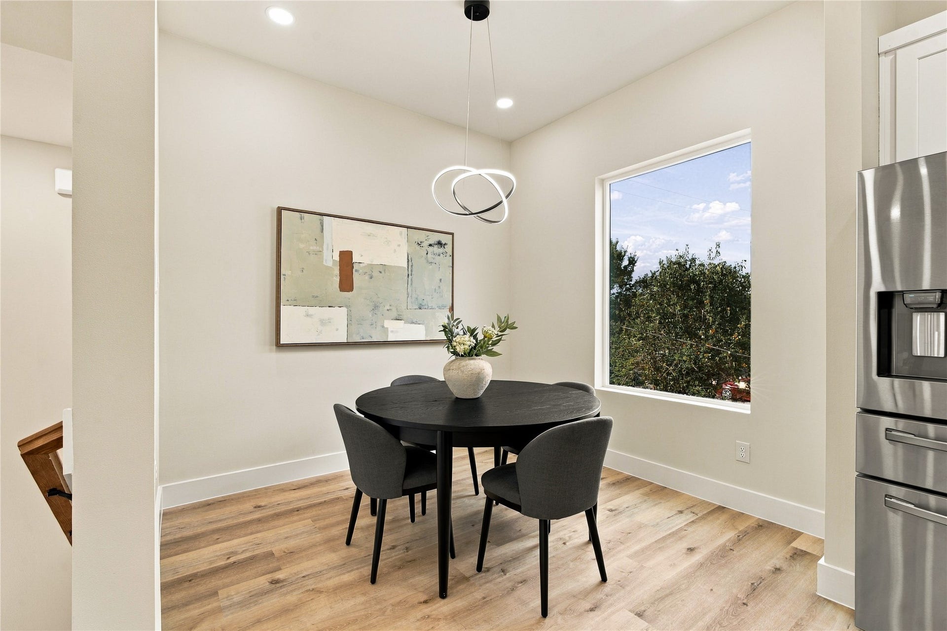 4717 Branch Street, Houston, TX 77021 Intimate dining nook sunny corner framed by green tree views for memorable dinners and morning tea.