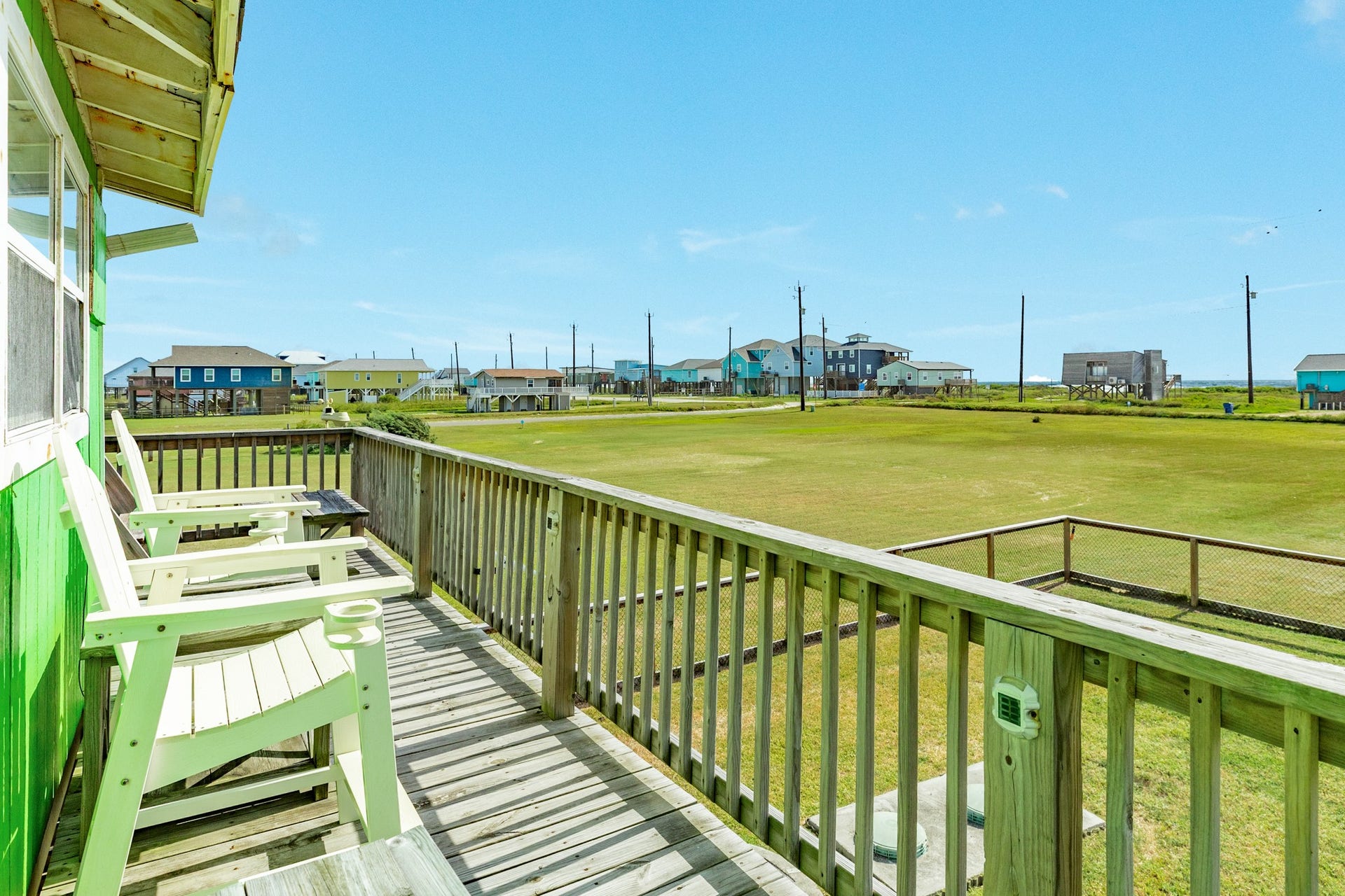 Additional deck seating takes advantage of the expansive open views and coastal setting surrounding the property.
