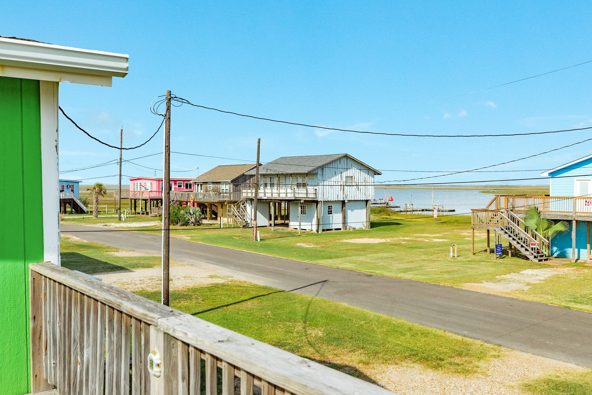 View from the deck looks across the neighborhood toward the bay, bringing the coastal surroundings into focus.