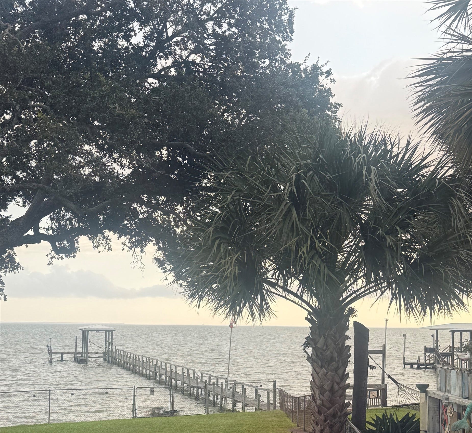 4715 W Bayshore Drive, Bacliff, TX 77518 Beautiful waterfront view of the bay and pier.