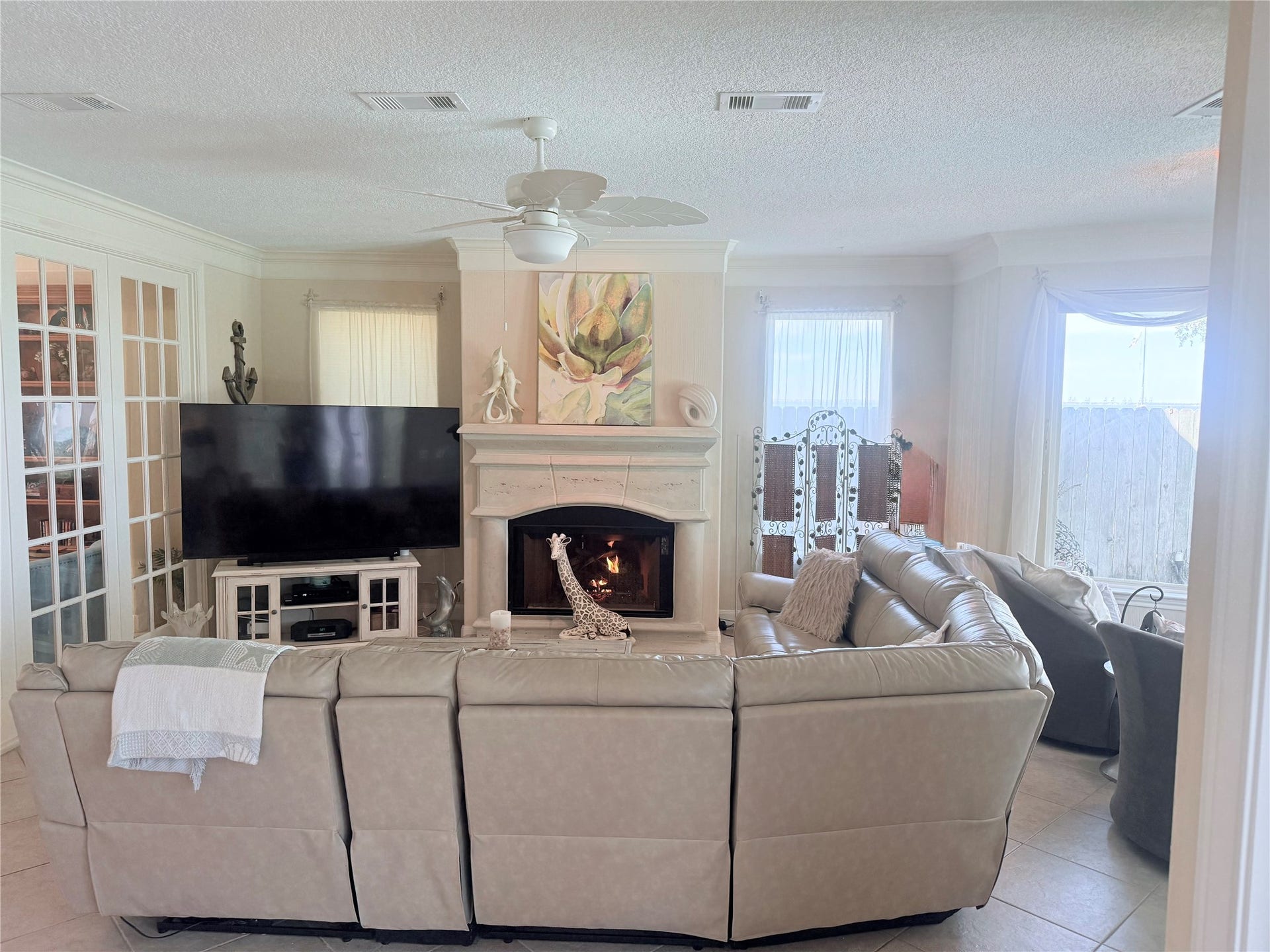 4715 W Bayshore Drive, Bacliff, TX 77518 Another view of the living room with the gas fireplace.
