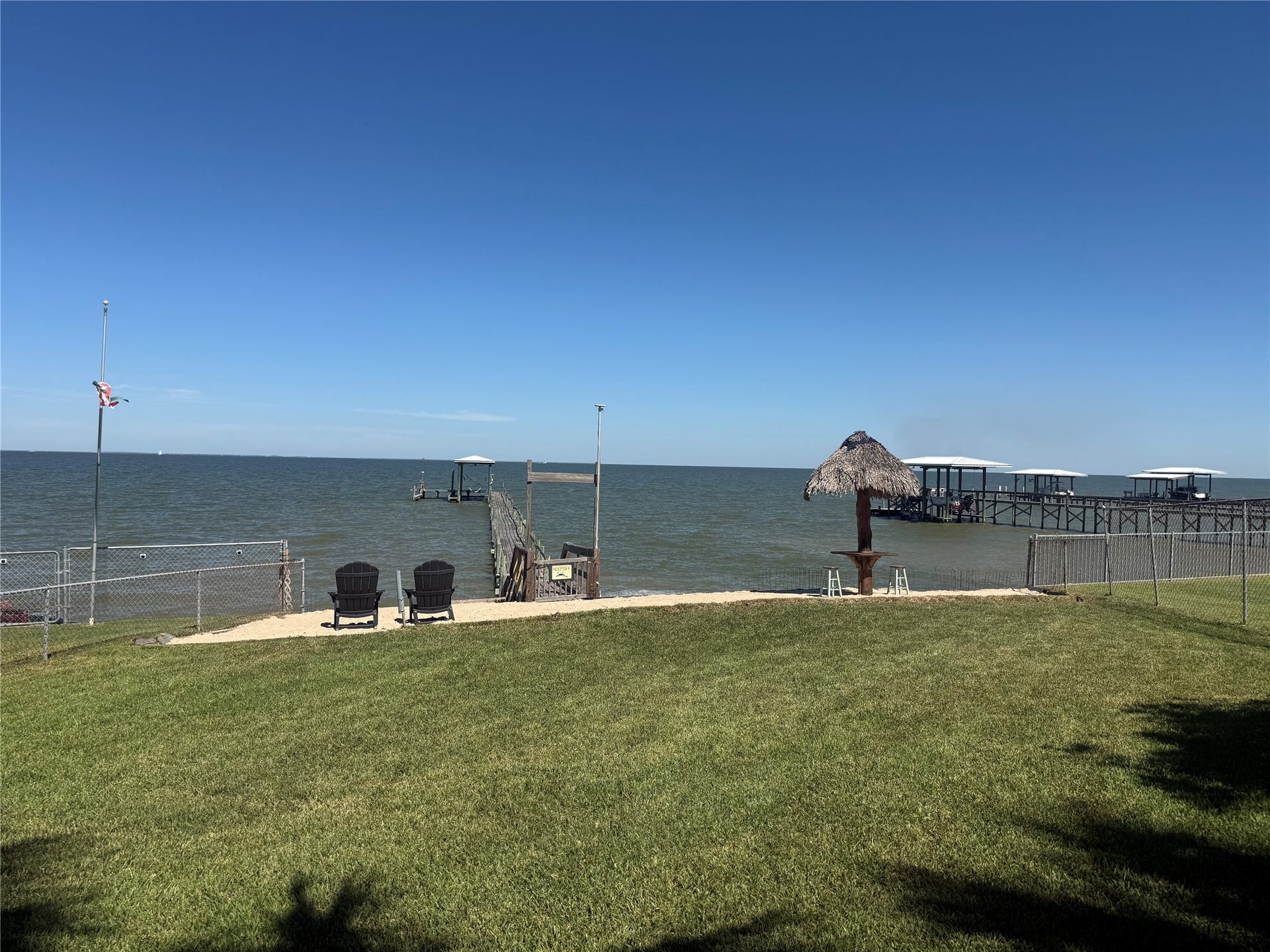 4715 W Bayshore Drive, Bacliff, TX 77518 View of Beach, Palapa and Bay.