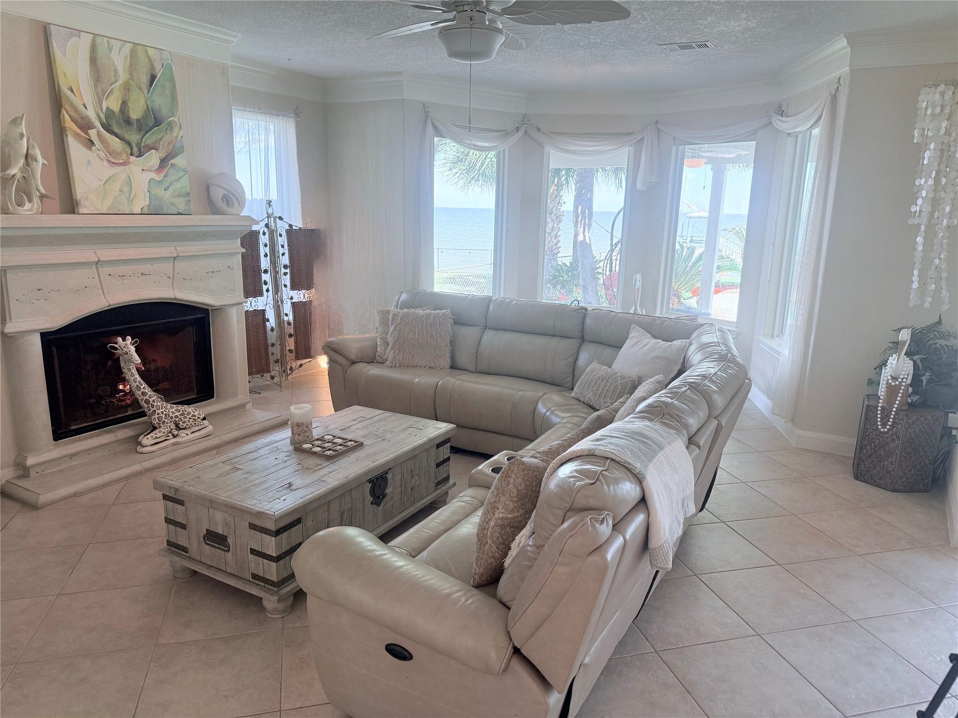 4715 W Bayshore Drive, Bacliff, TX 77518 Open plan living room with a gas fireplace.