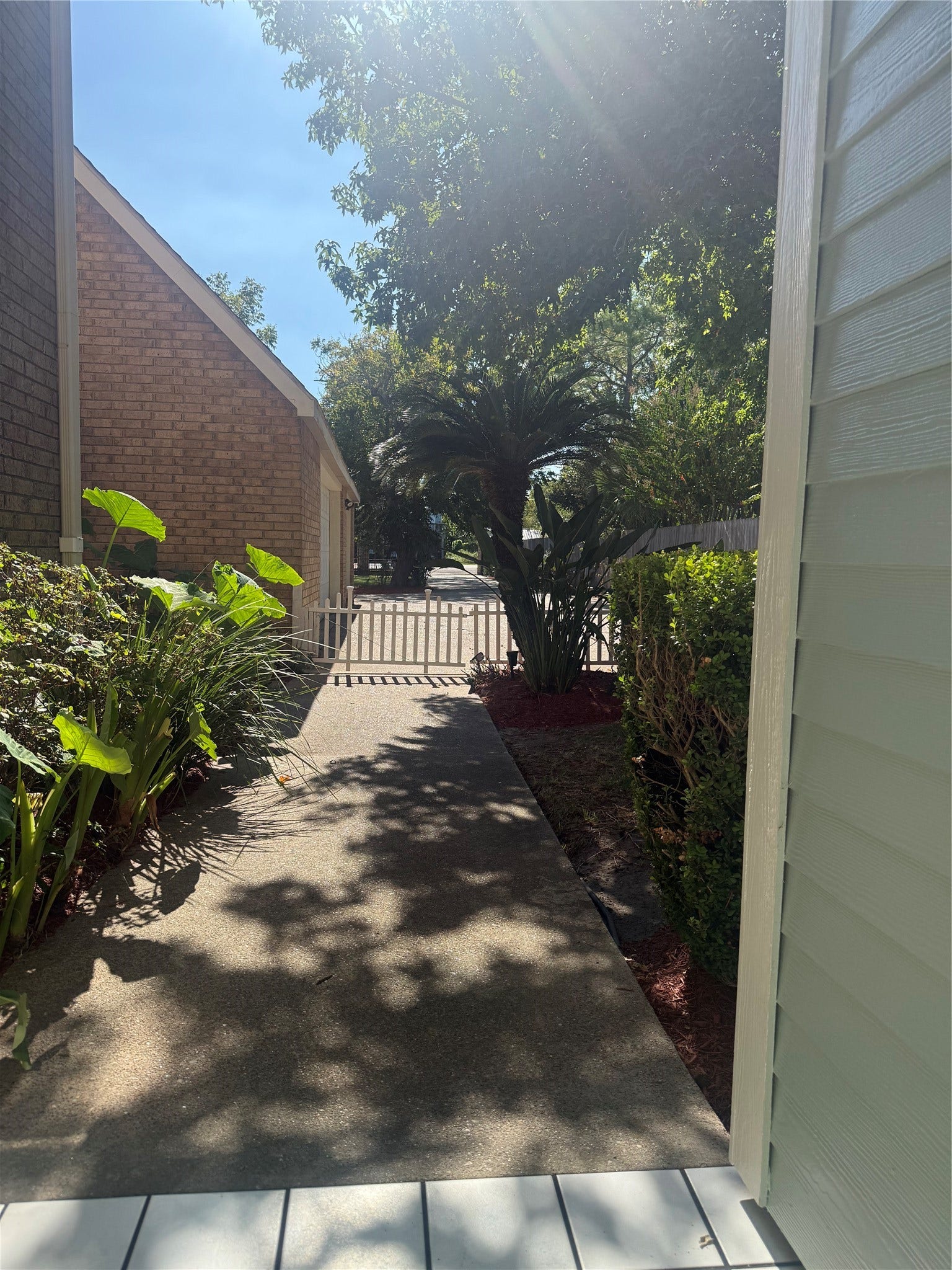 4715 W Bayshore Drive, Bacliff, TX 77518 View from front door to driveway and 3 car garage.