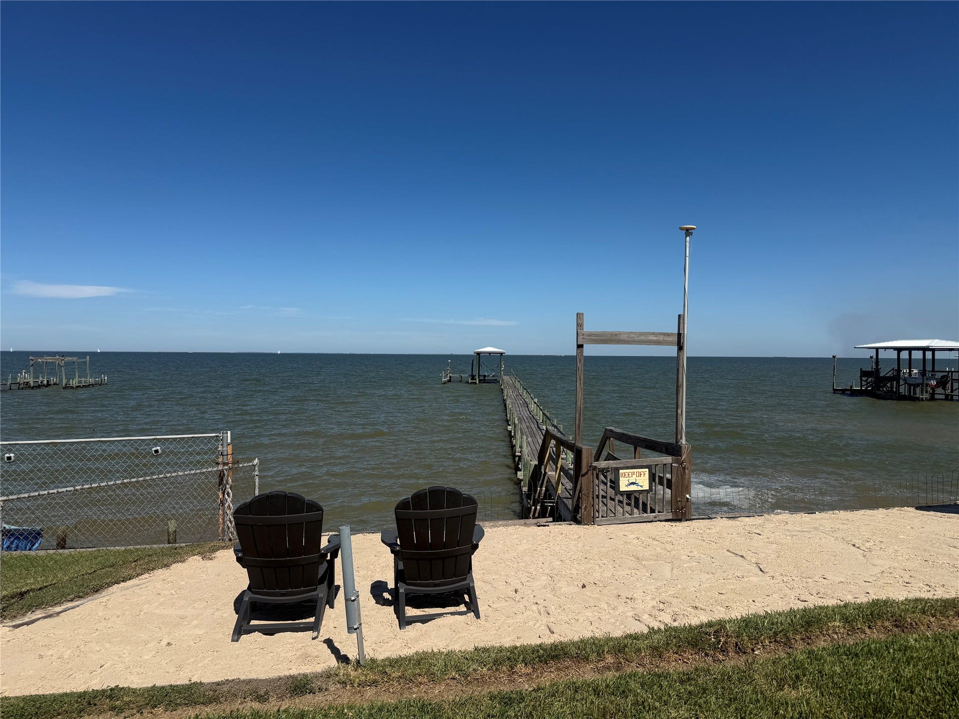 4715 W Bayshore Drive, Bacliff, TX 77518 Come try out the deck chairs on the private beach.