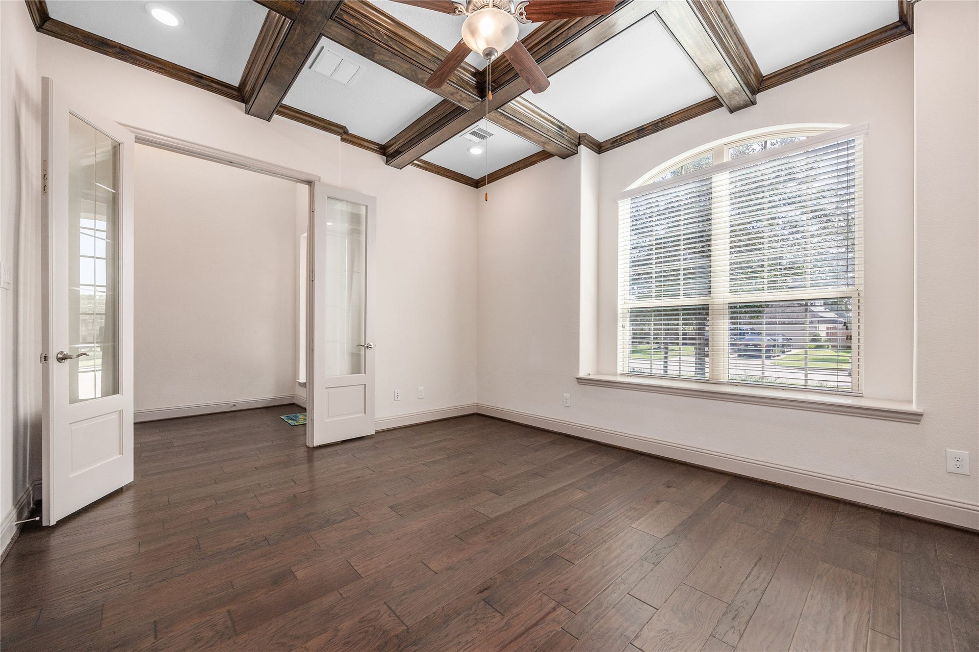 13506 COLUMBIA KEY Drive, Tomball, TX 77377 A bright, versatile room with French doors, wood floors, and distinctive ceiling beams.