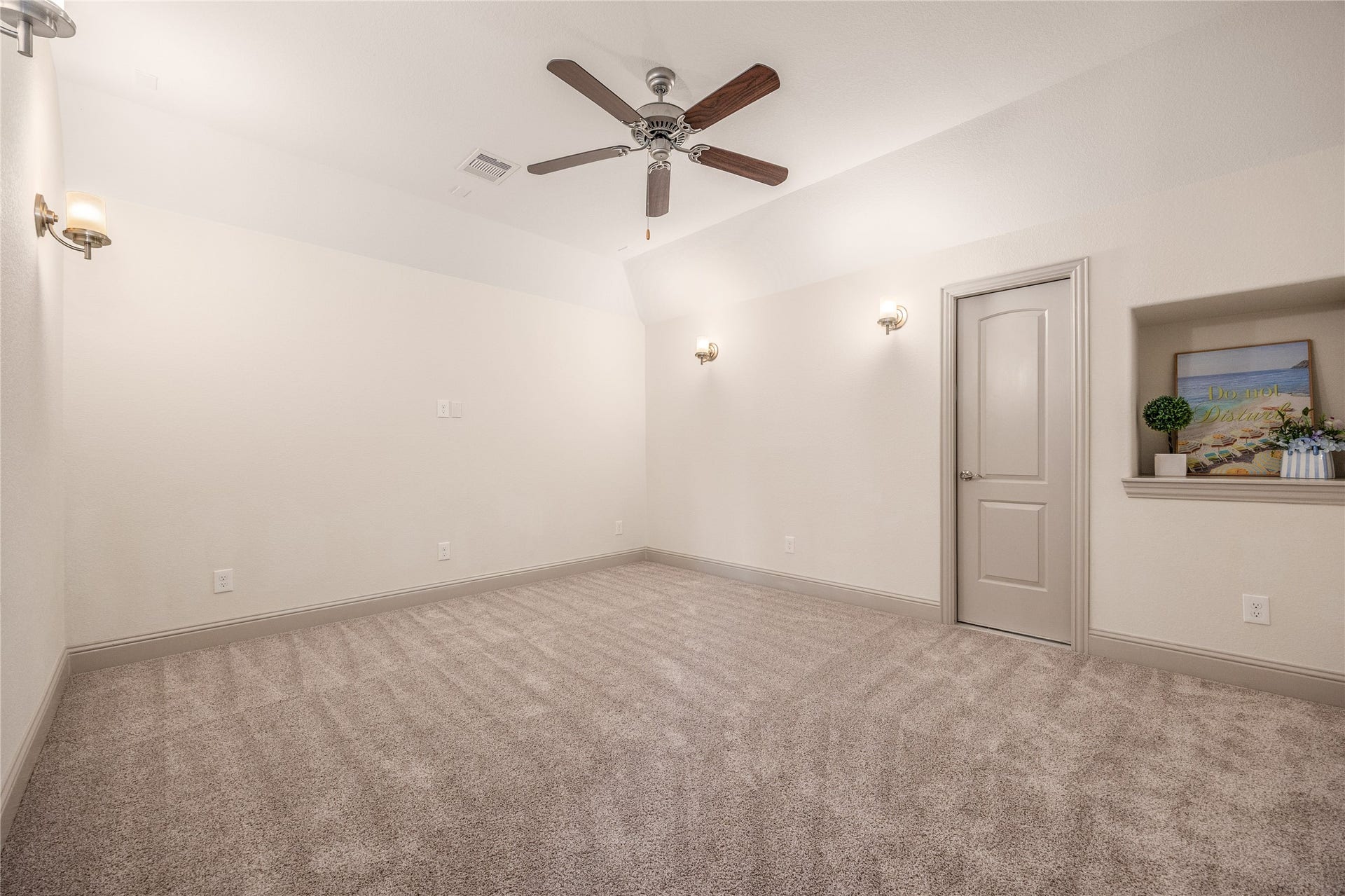 13506 COLUMBIA KEY Drive, Tomball, TX 77377 Movie nights have their own space in this media room, with easy walk-in access to a spacious attic for storage.