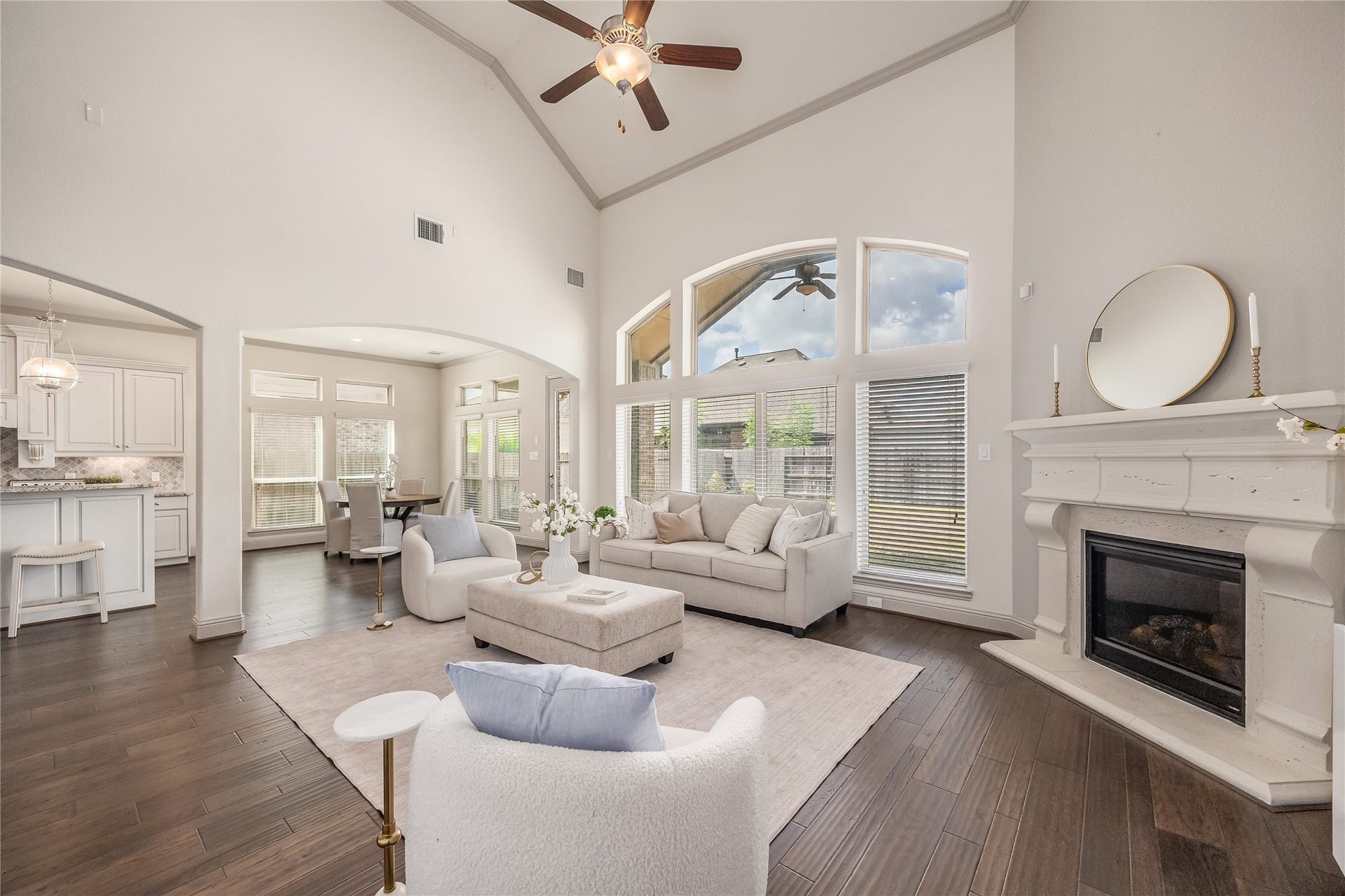 13506 COLUMBIA KEY Drive, Tomball, TX 77377 The living room flows into the dining nook and kitchen, keeping everyone connected whether youre hosting or enjoying a quiet night in.