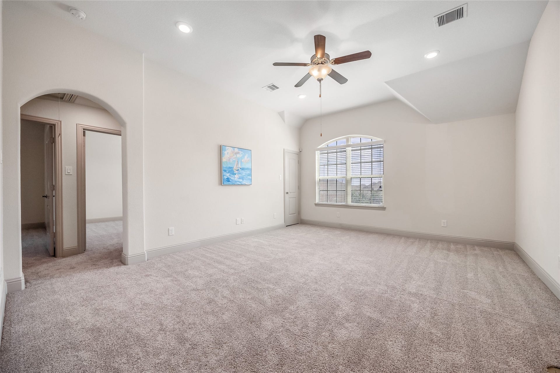 13506 COLUMBIA KEY Drive, Tomball, TX 77377 Another view of the upstairs game room shows just how much space there is to make it your own, with a vaulted ceiling and arched window bringing in natural light.