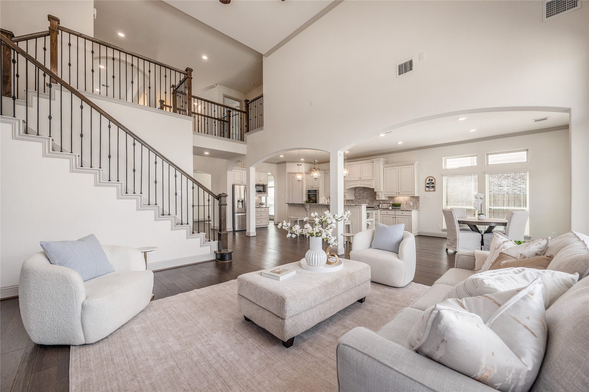 13506 COLUMBIA KEY Drive, Tomball, TX 77377 Soaring ceilings make this open living space feel even brighter, while the gas fireplace adds a cozy place to gather.