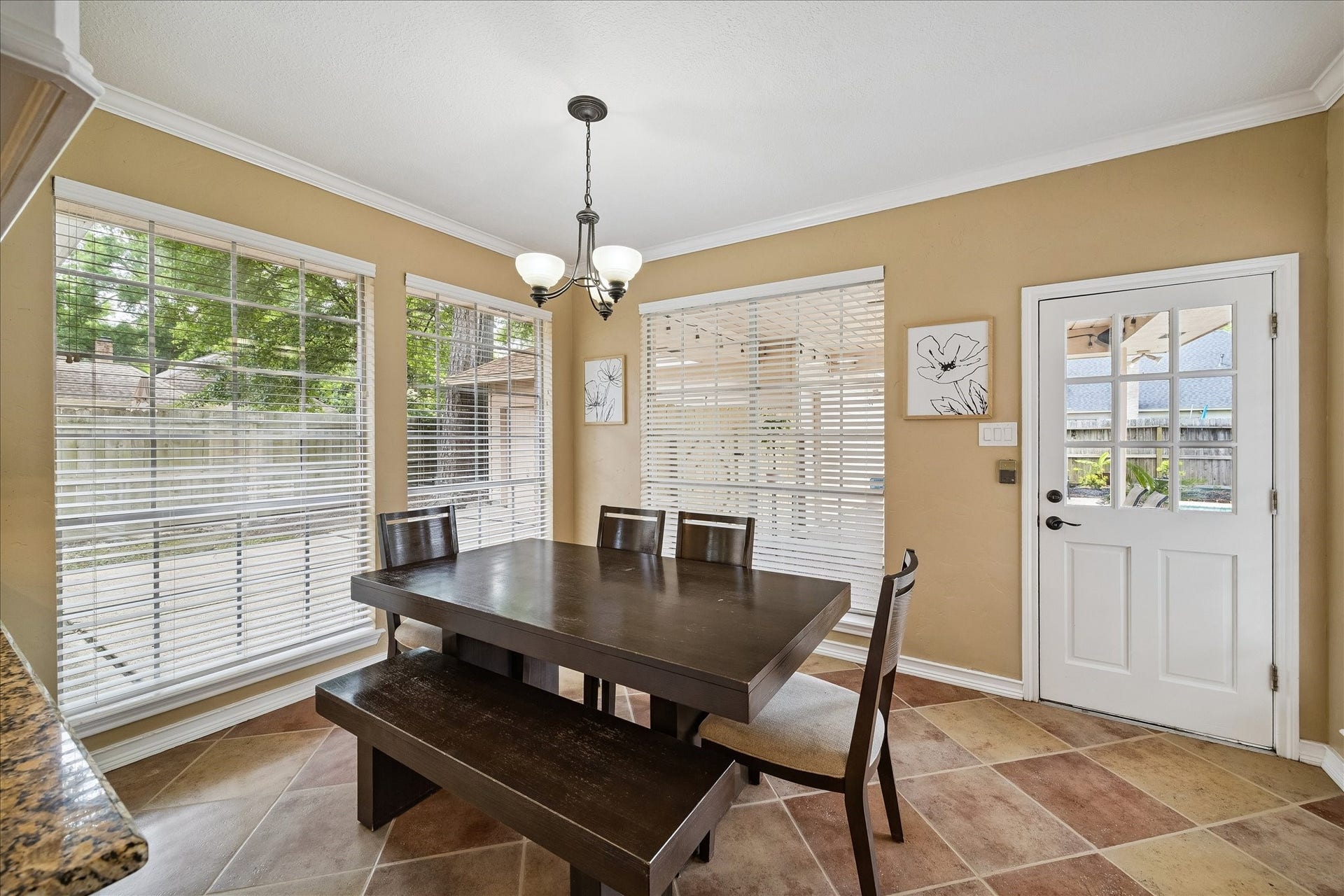 2919 Forest Garden Drive, Kingwood, TX 77345 This huge dining area is hosting a very large table. Look at all the light here.