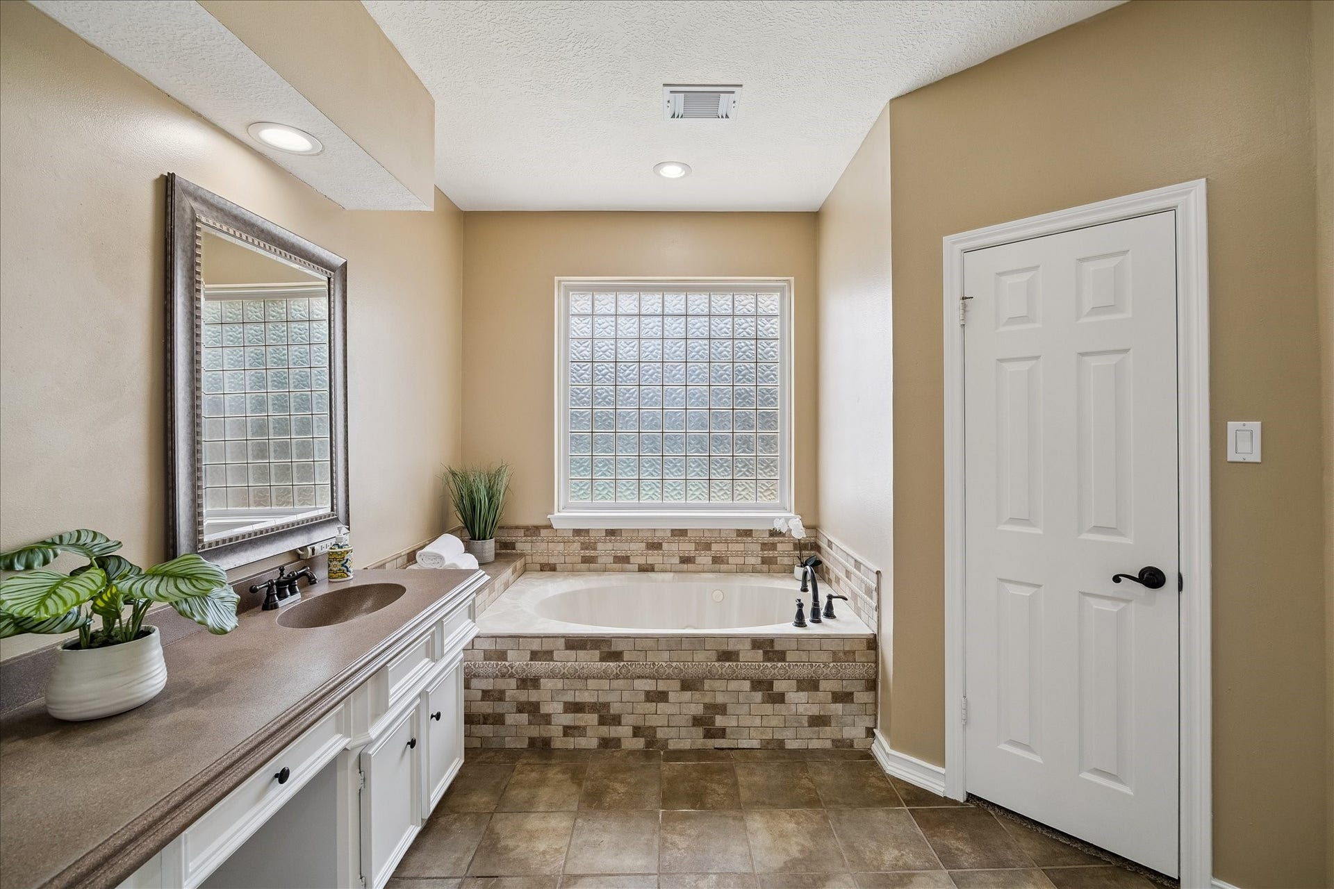 2919 Forest Garden Drive, Kingwood, TX 77345 Plenty of room here. There are his/ her closets. The shower is just to the right.