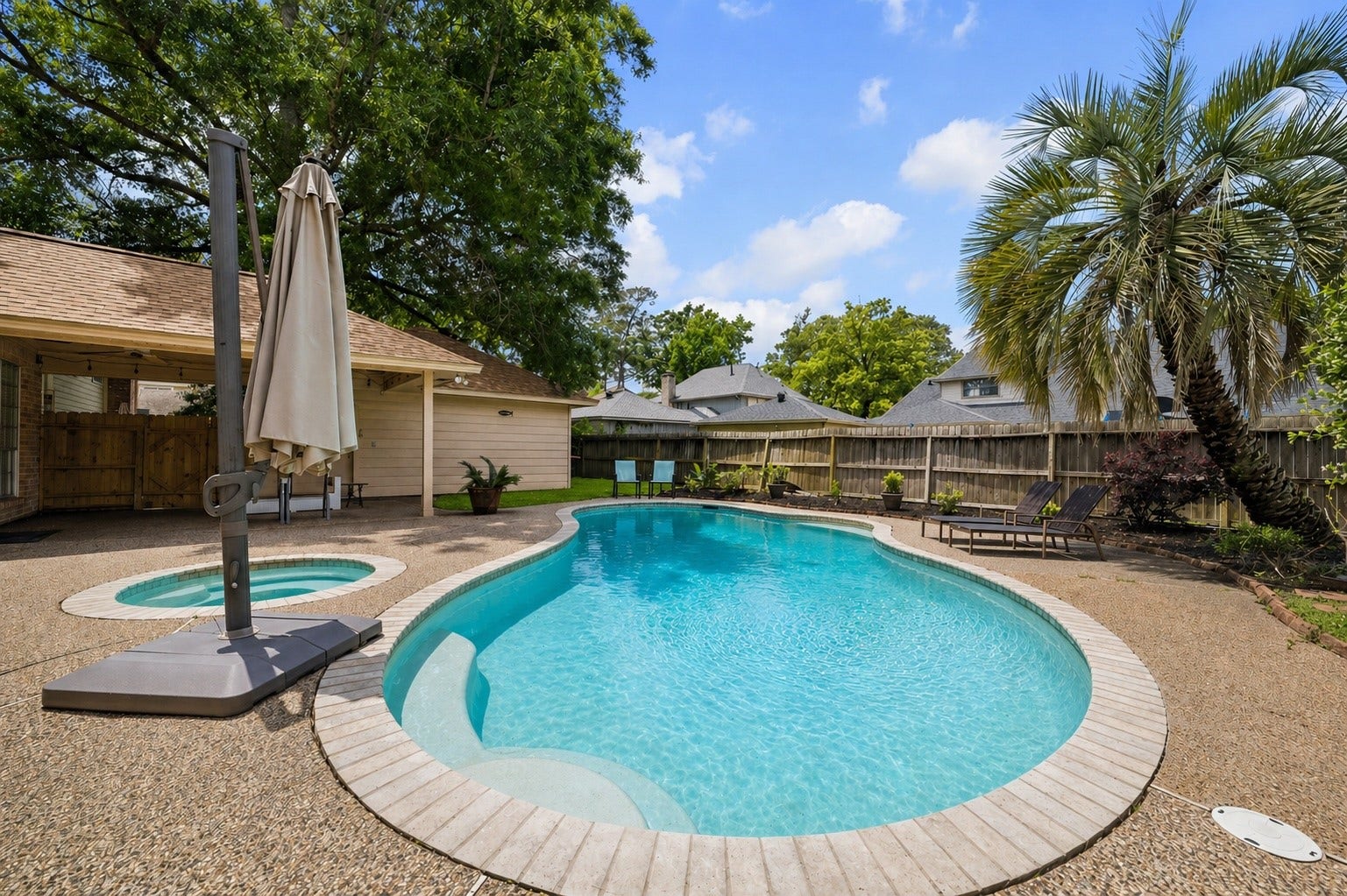 2919 Forest Garden Drive, Kingwood, TX 77345 Enjoy your large pool with a hot tub.