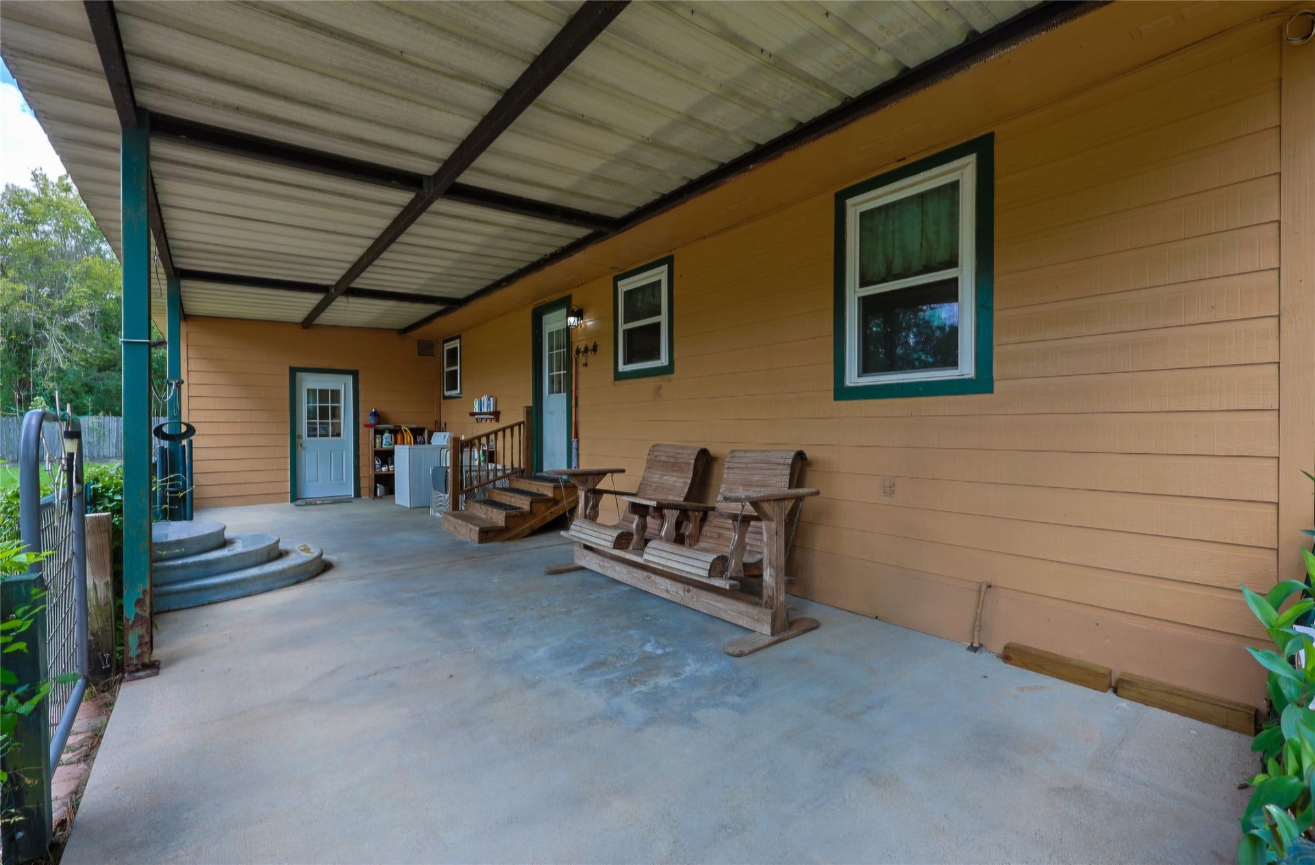 4110 Sherri Lane, Crosby, TX 77532 Back Patio with access to kitchen/mud room, and 2nd door to Primary Bd rm.