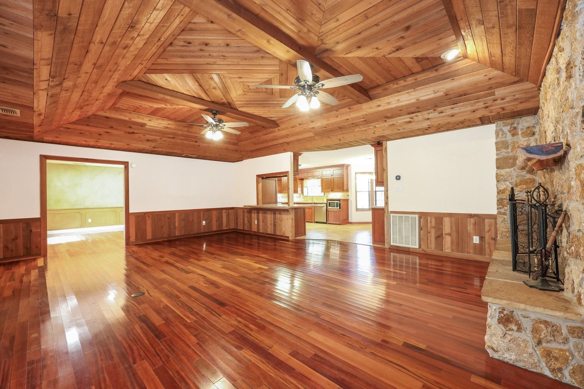 22107 Rosewood Trail, Tomball, TX 77377 Large Family Room with a Beautiful Wood Ceiling and a Stone-Faced Wood-Burning Fireplace.