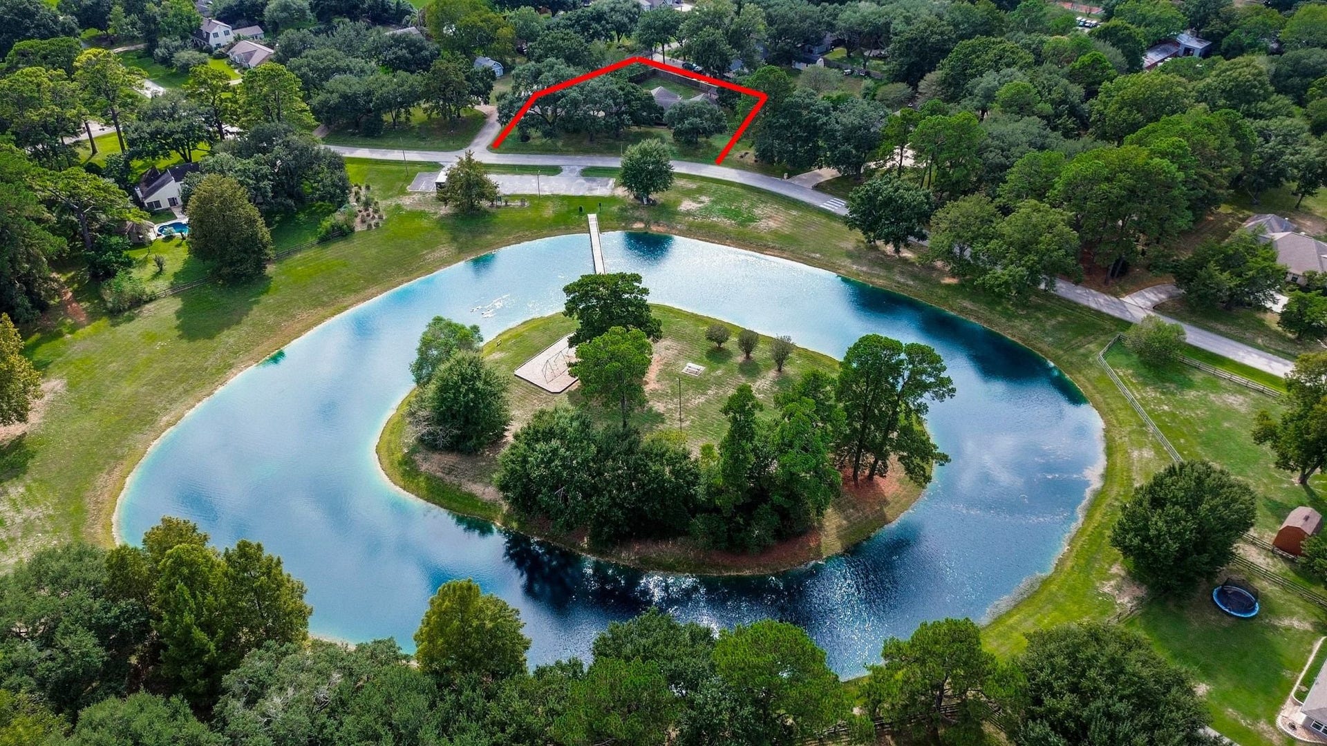 22107 Rosewood Trail, Tomball, TX 77377 Aerial View of the Home which is Across the Street from the Beautiful Neighborhood Lake with Island. Enjoy Watching the Kids Play on the Swings and Playground Equipment and have a Picnic at the Picnic Tables. Catch and Release Fishing. Don't Forget to Feed the Ducks!