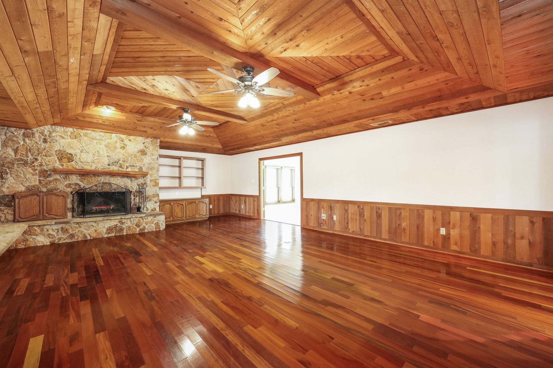 22107 Rosewood Trail, Tomball, TX 77377 Large Family Room with a Beautiful Wood Ceiling and a Stone-Faced Wood-Burning Fireplace.