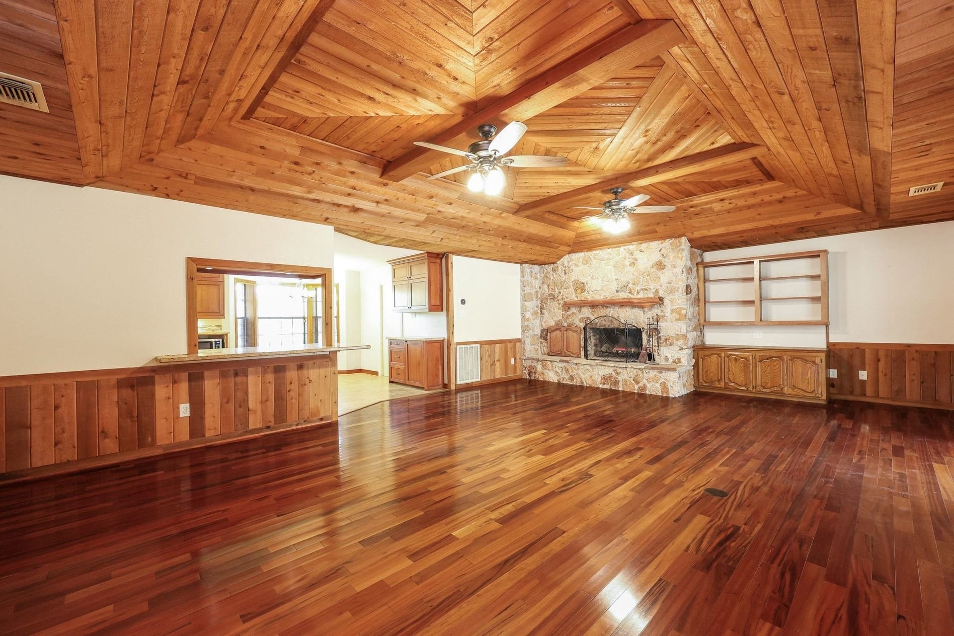 22107 Rosewood Trail, Tomball, TX 77377 Large Family Room with a Beautiful Wood Ceiling and a Stone-Faced Wood-Burning Fireplace.