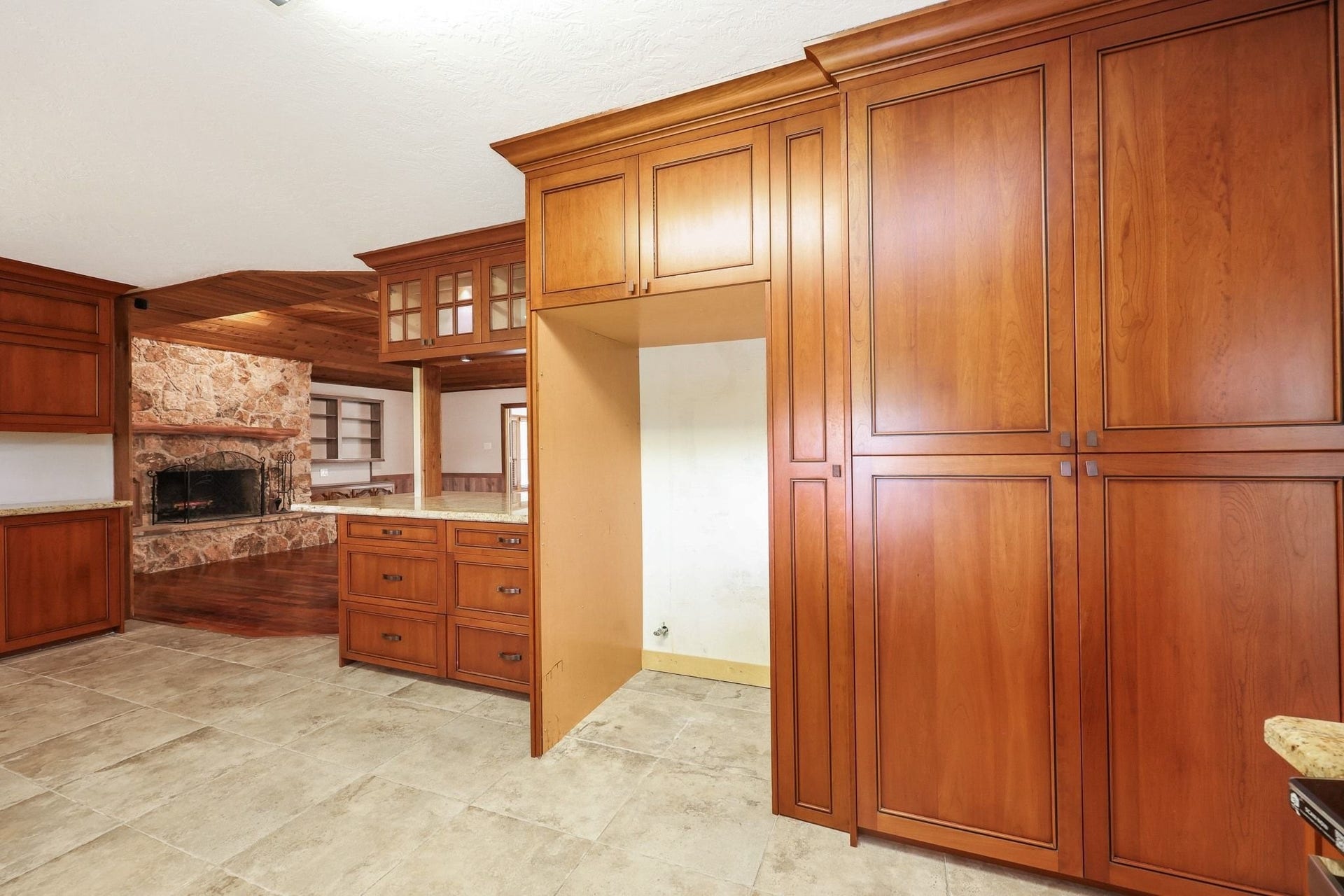 22107 Rosewood Trail, Tomball, TX 77377 Kitchen with Custom Cabinets, a Double Electric Oven, Pantry Storage, Microwave Shelf has Beautiful Views of the Neighborhood Lake