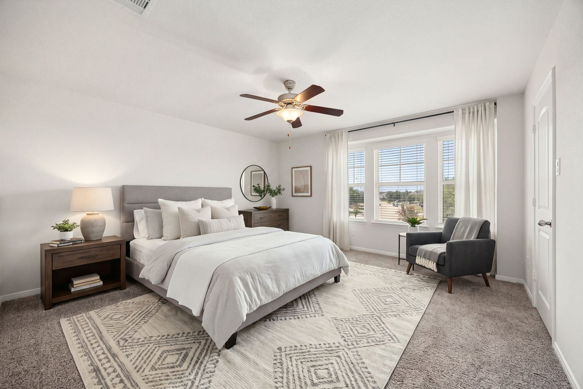 23643 Balzano Court, Katy, TX 77493 Sun-drenched secondary bedroom featuring a prominent three-panel feature window that captures expansive neighborhood views.