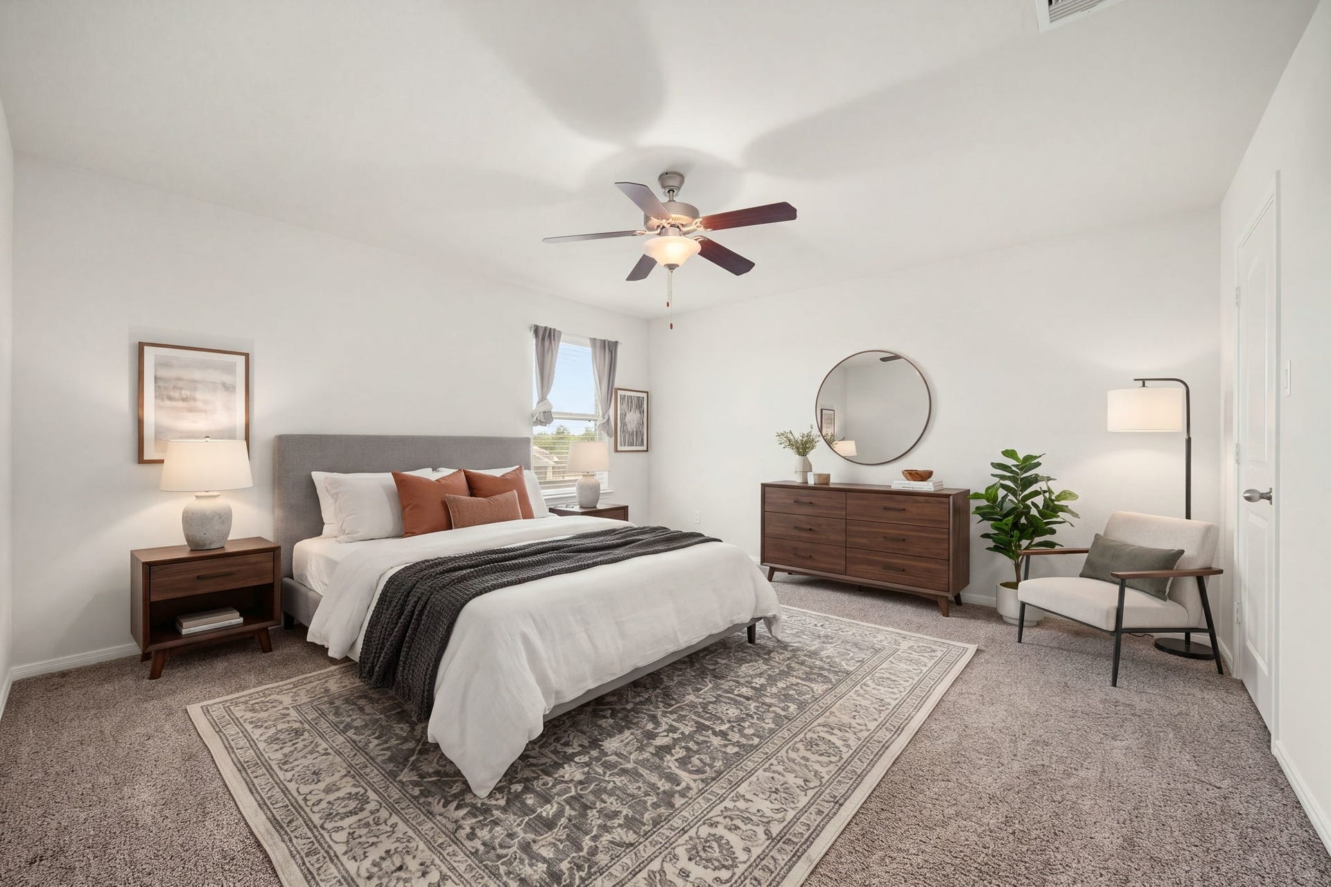 23643 Balzano Court, Katy, TX 77493 Comfortable secondary bedroom offering a clean-lined layout, warm plush carpeting, and a central modern ceiling fan.