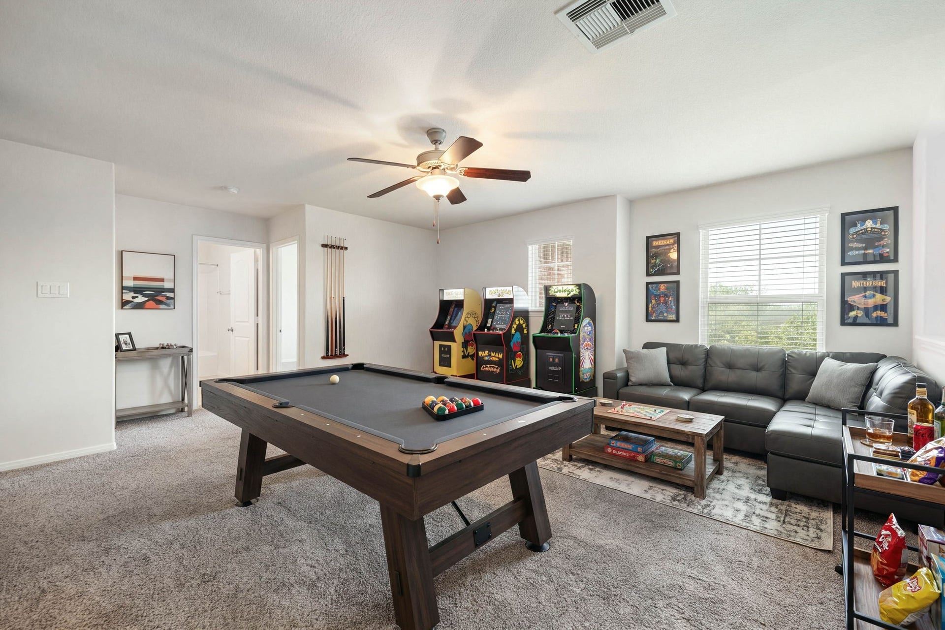 23643 Balzano Court, Katy, TX 77493 Versatile second-floor loft and game room featuring an expansive layout, plush carpeting throughout, and excellent natural light.
