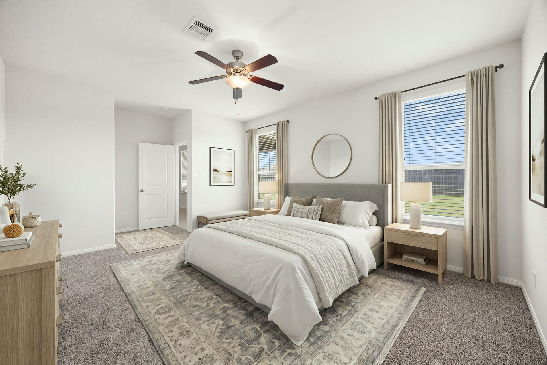 23643 Balzano Court, Katy, TX 77493 Serene primary bedroom suite showcasing plush carpeting, dual oversized windows, and a large walk-in closet entry.