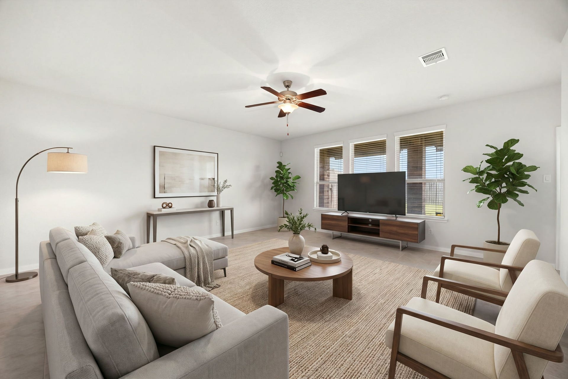 23643 Balzano Court, Katy, TX 77493 Spacious and sun-drenched living area featuring expansive neutral flooring, large triple-pane windows, and a central modern ceiling fan with an integrated light fixture.