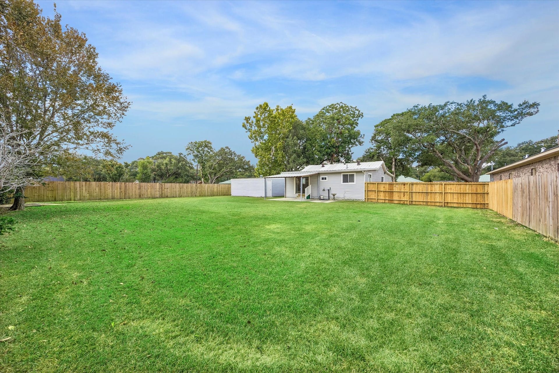 218 N Ormsby Street, Alvin, TX 77511 Oversized backyard for all those outside games.