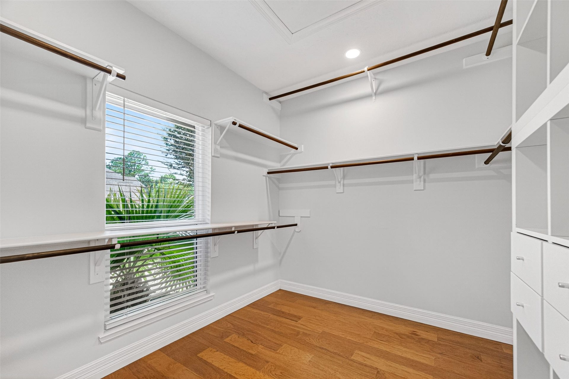 Discover the luxury of ample storage in this beautifully designed, light-filled walk-in closet, offering a perfect blend of functionality and elegance.