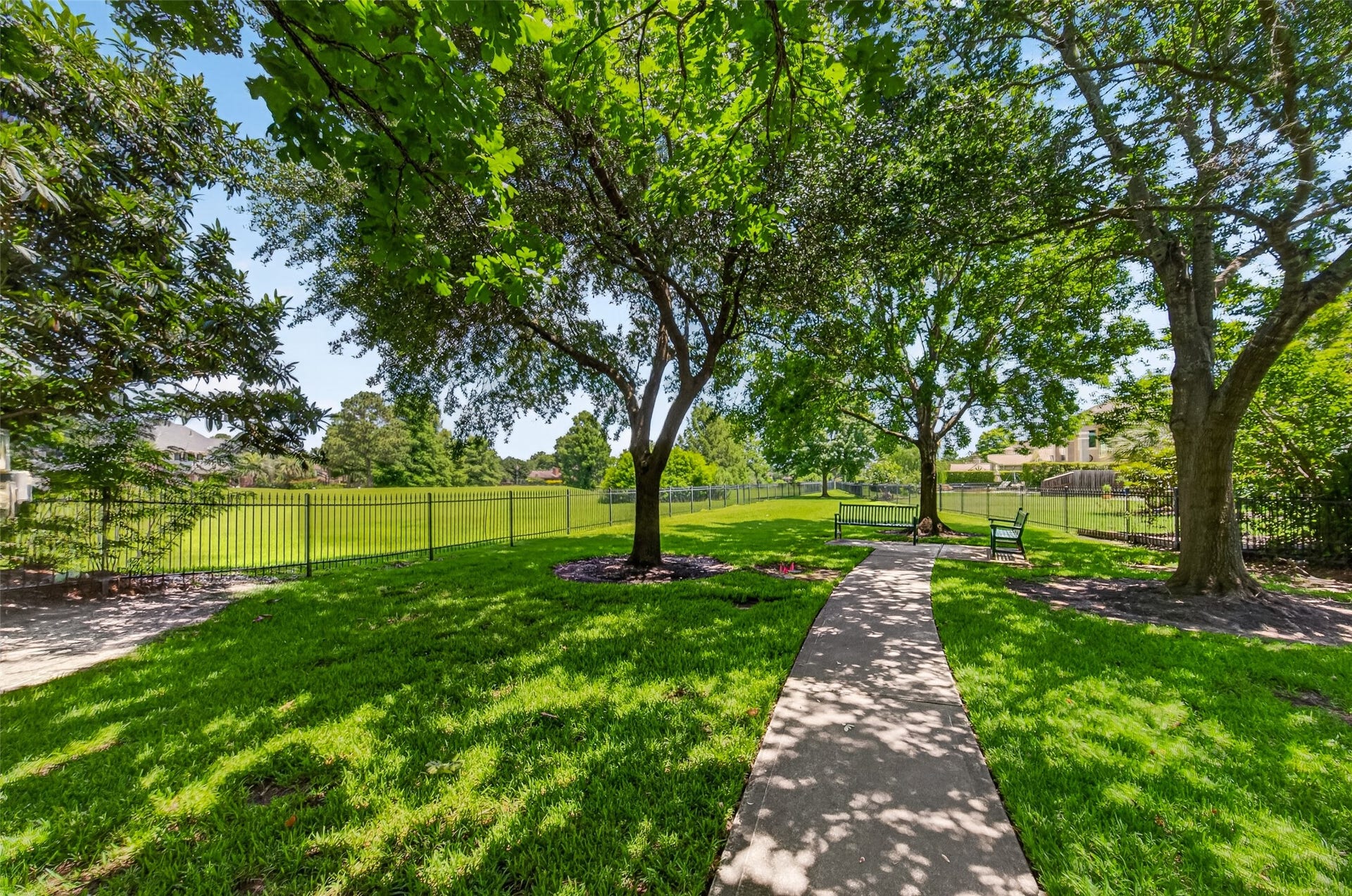 Nestled next to the home, a charming community park offers lush green spaces and shaded picnic areas perfect for family gatherings and outdoor fun.