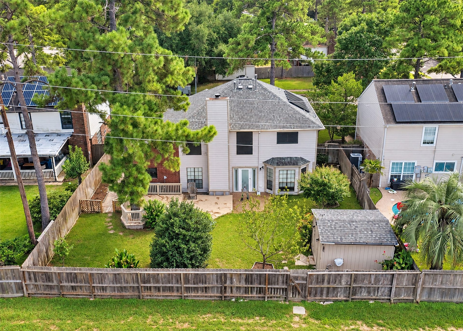 Spacious backyard offers plenty of room for outdoor entertaining, play, gardening, or simply relaxing. Mature fruit trees add charm and provide a wonderful natural touch to the outdoor space.