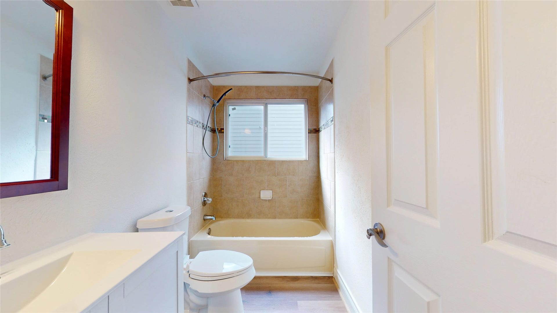 Remodeled secondary bathroom featuring updated finishes and a fresh, modern look.