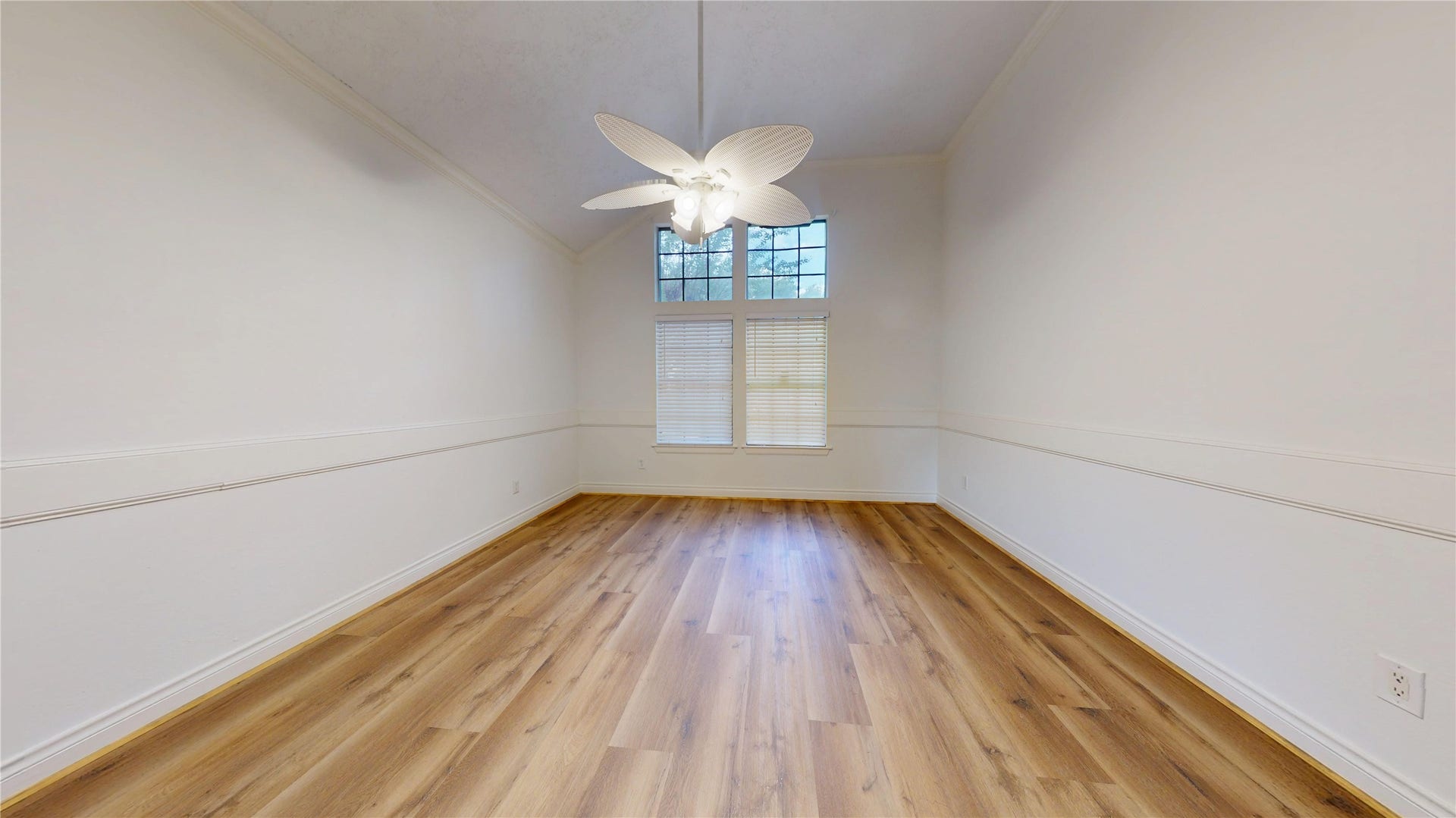 Spacious primary bedroom with plenty of room for comfortable furnishings.