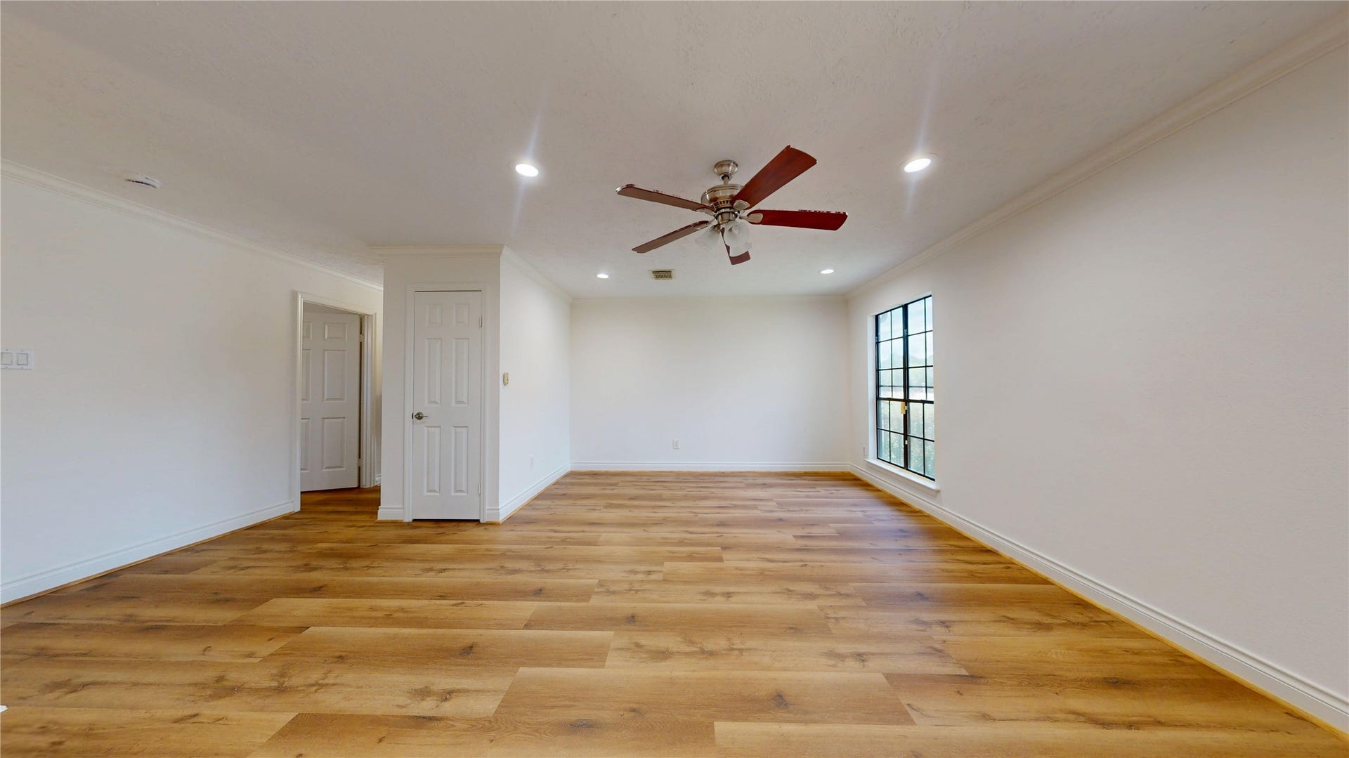 Spacious game room with abundant room for a game table, media setup, or flexible recreational space.
