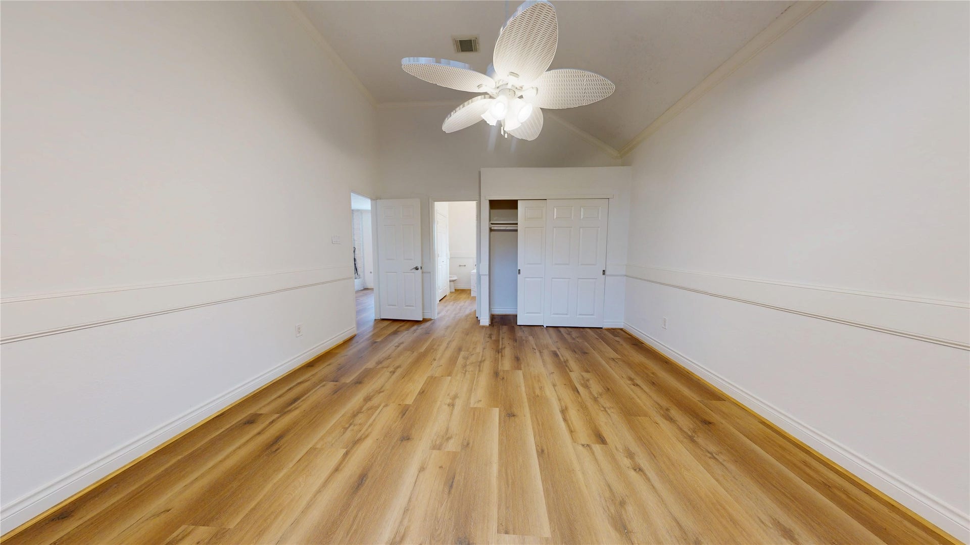Generous closet space provides convenient storage within the primary bedroom.